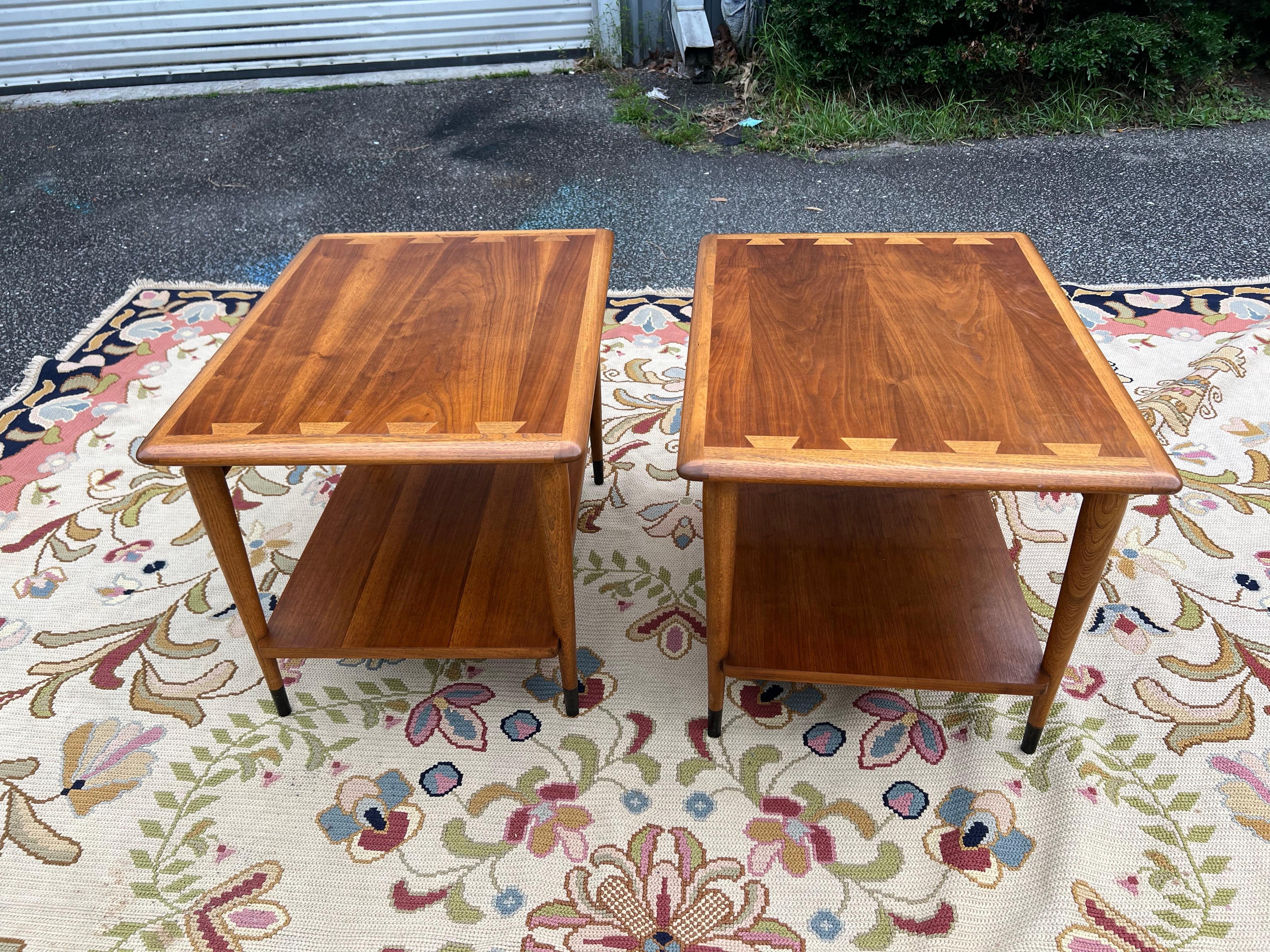 Lane Acclaim End Tables by Andre Bus

Acclaim series side tables with shelf by Andre Bus for lane. The acclaim series side tables feature a two-tone dovetail designed top made of oak and walnut, rounded tabletop edges, and tapered legs. 1960’s