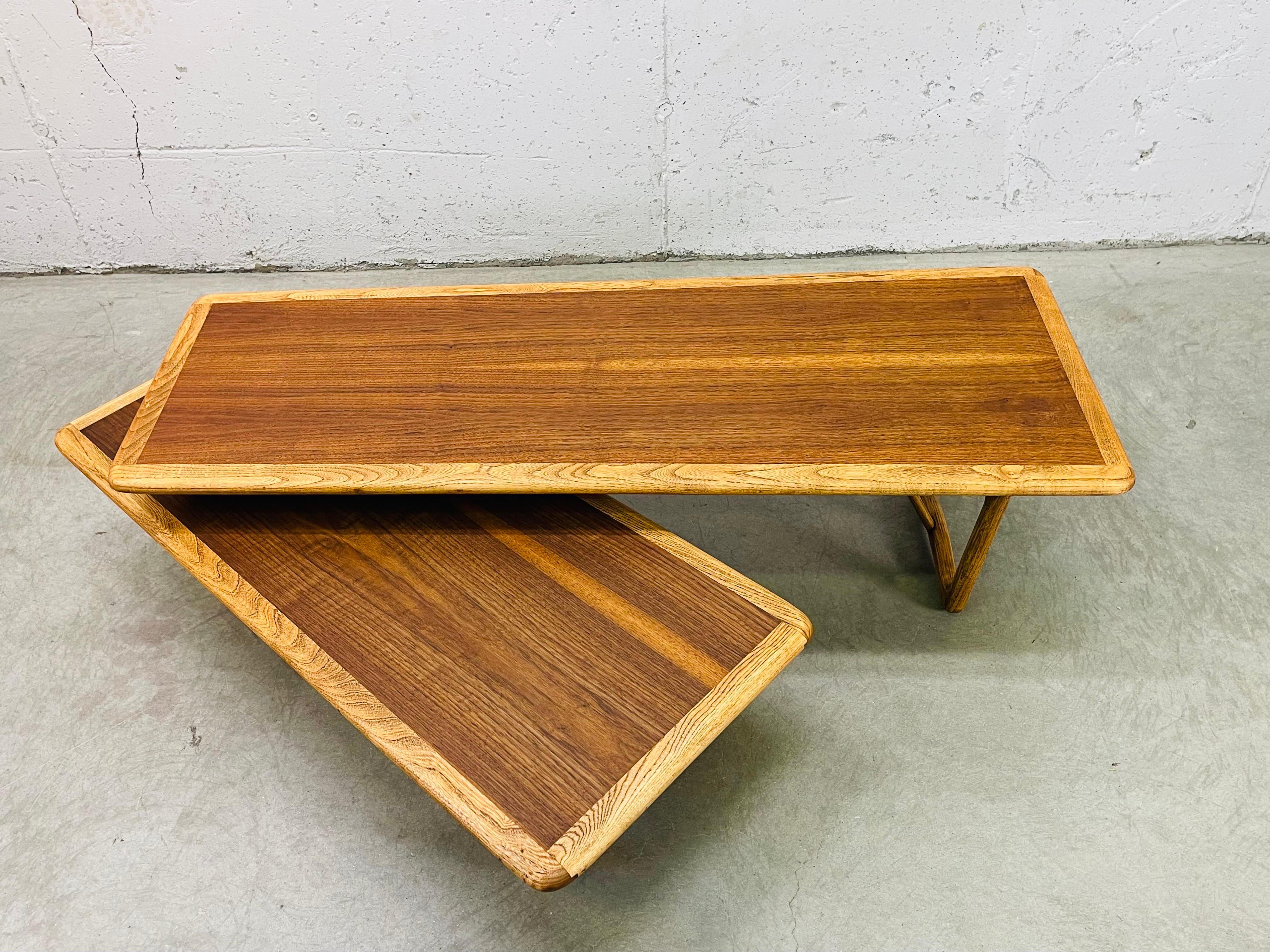 Vintage 1960s Lane Furniture solid walnut wood Switchblade style coffee table. The coffee table swivels in all directions and the extension measures 42”L x 19”W x 11”H. The table is in excellent refinished condition and is sturdy. The wood grain is