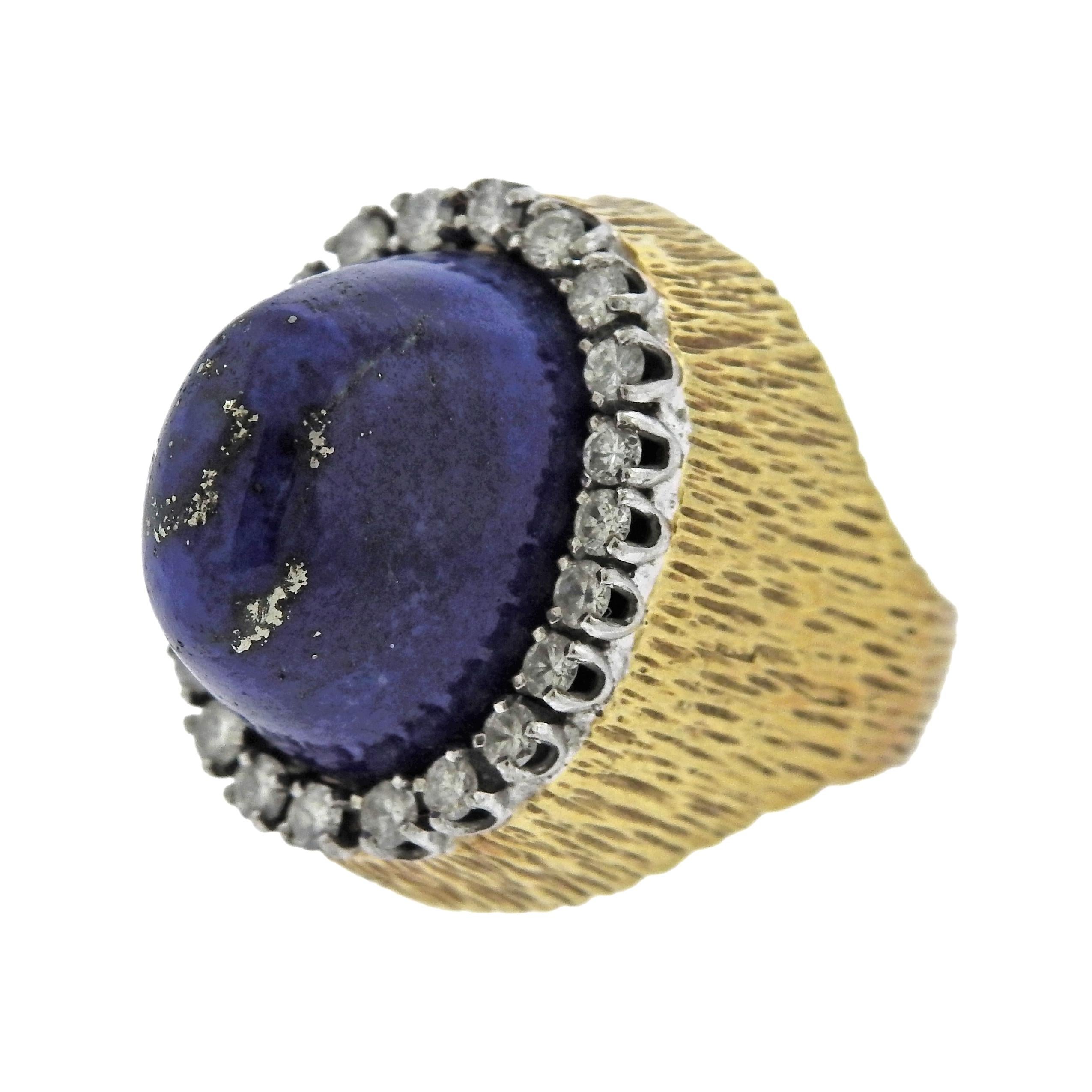 Large circa 1960s cocktail ring, set with lapis lazuli, surrounded with approx. 1.10ctw in SI/H diamonds. Ring size - 6.5, ring top - 25mm x 20mm, sits approx. 24mm from the finger. Weight is 25.4 grams, marked 18k, Swiss Art. 