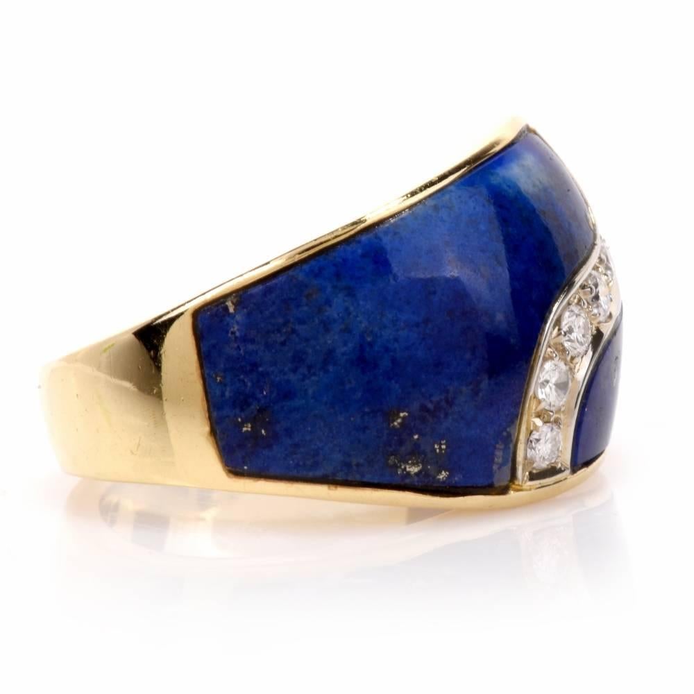 Designed as a gracefully domed plaque, this captivating estate cocktail ring is crafted in solid 18 karat yellow gold, weighing 10.4 grams and measuring 13 mm wide. The upper surface of the ring is set with clibrated  lapis lazuli enriched with 7