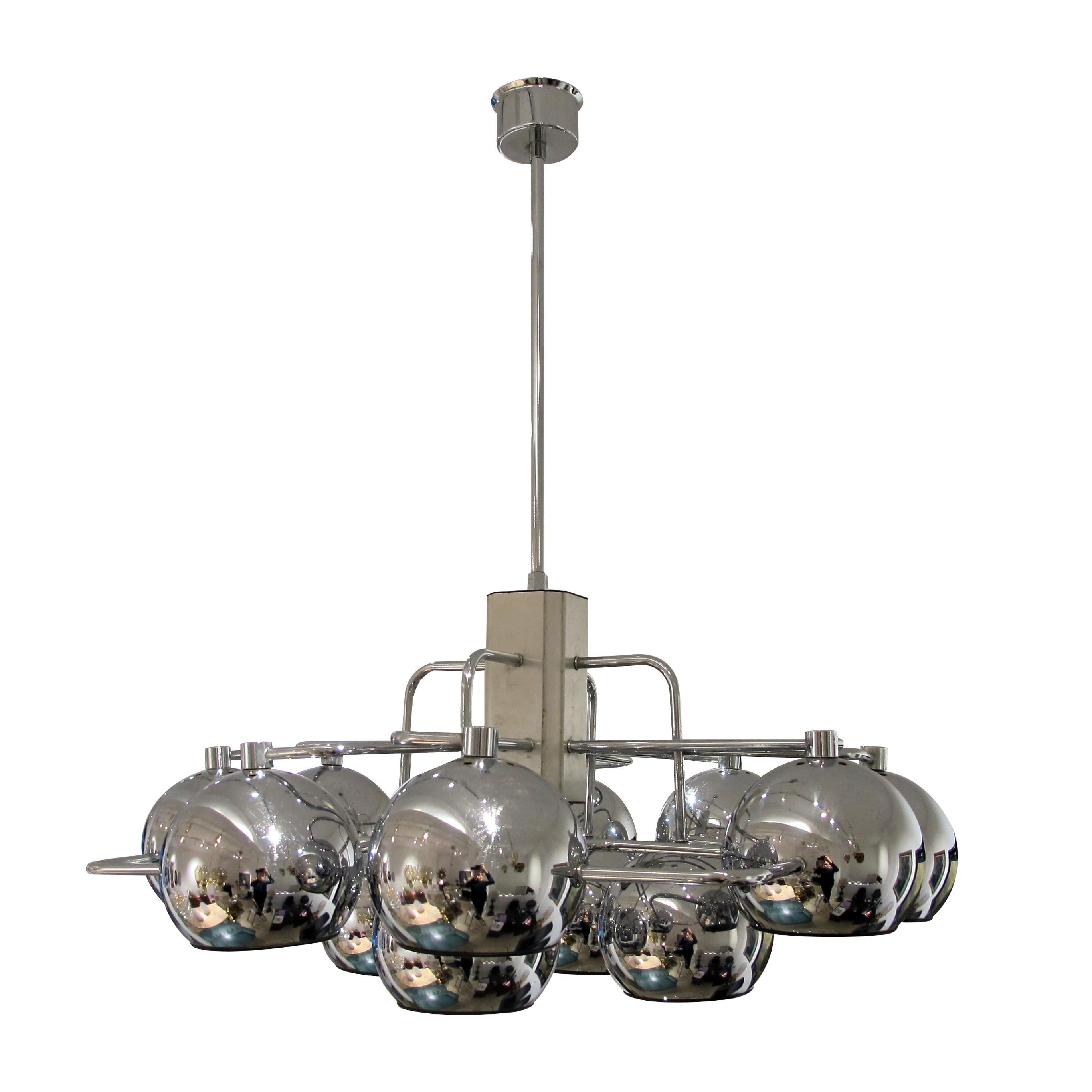 The 12 Chrome Globes Geometric Frame Ceiling Light designed by G. Sciolari in the 1960s is a masterpiece that encapsulates the essence of mid-century modern design. Its impeccable craftsmanship, striking geometric structure, and chrome-plated globes