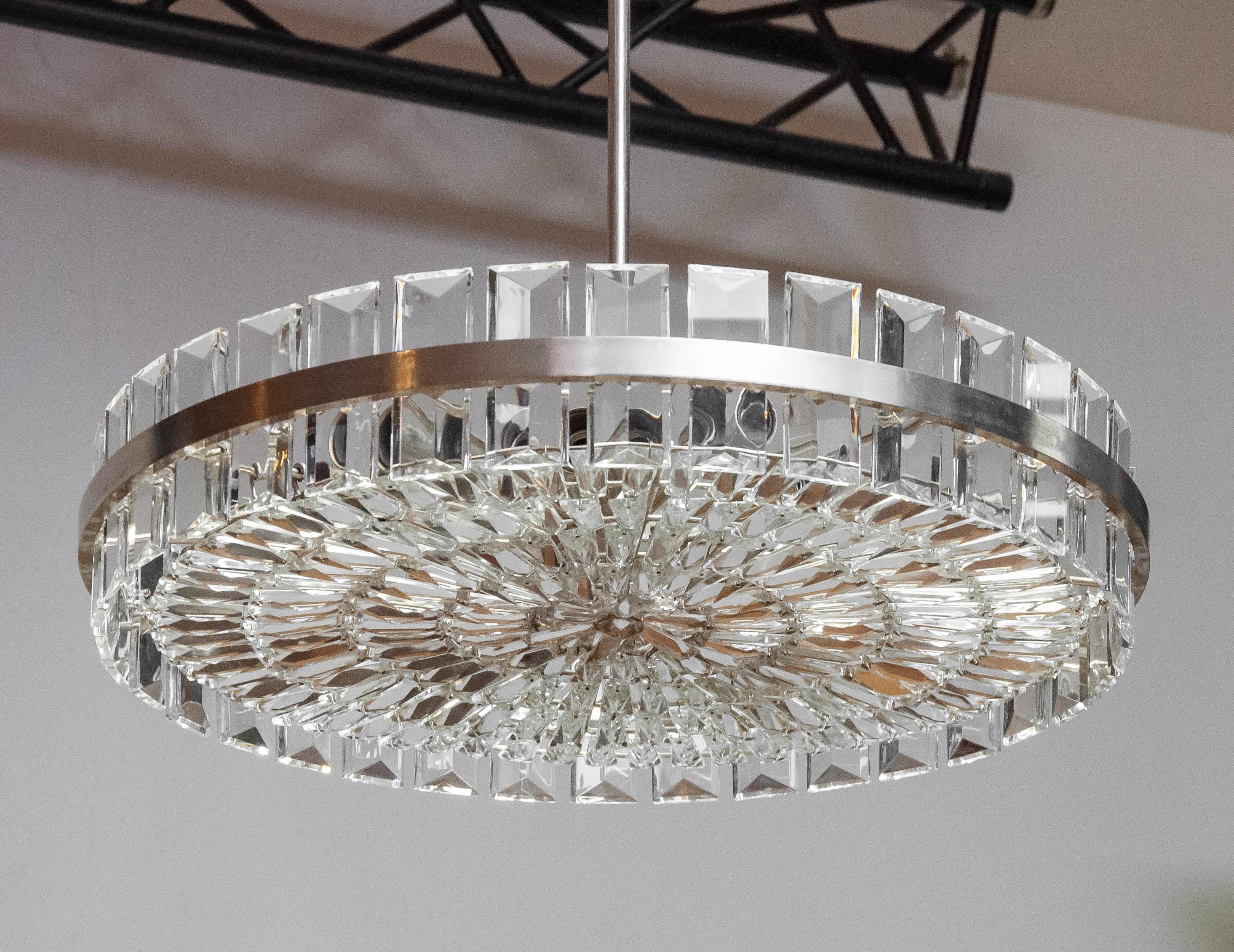 Very exclusive and beautiful large high quality chandelier / flush mount by Bakalowits & Söhne Austria from the 1960s. It is made of hand-cut crystals and a nickel-plated (chrome) frame. 
The chandelier contains twelve E27/28 screw fittings.
The