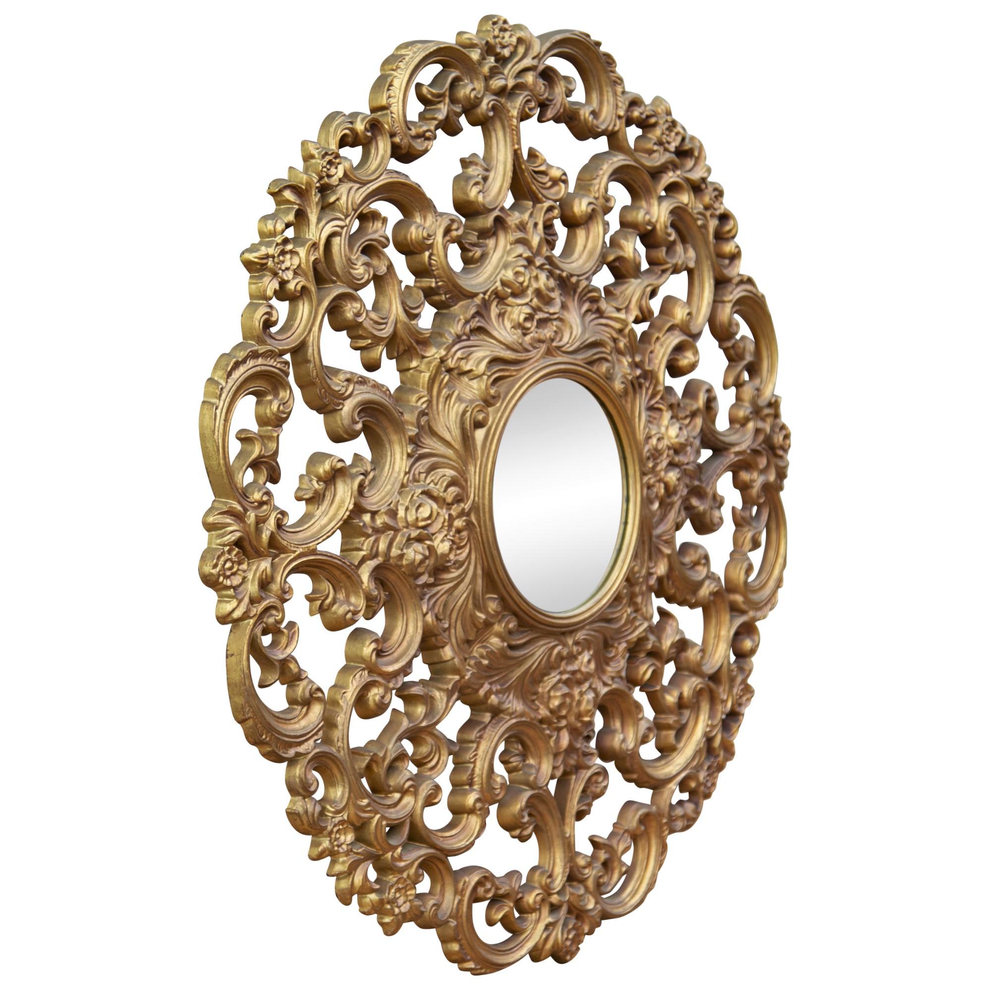 Midcentury Baroque or Rococo style gold cast resin mirror, circa 1960s. This 31