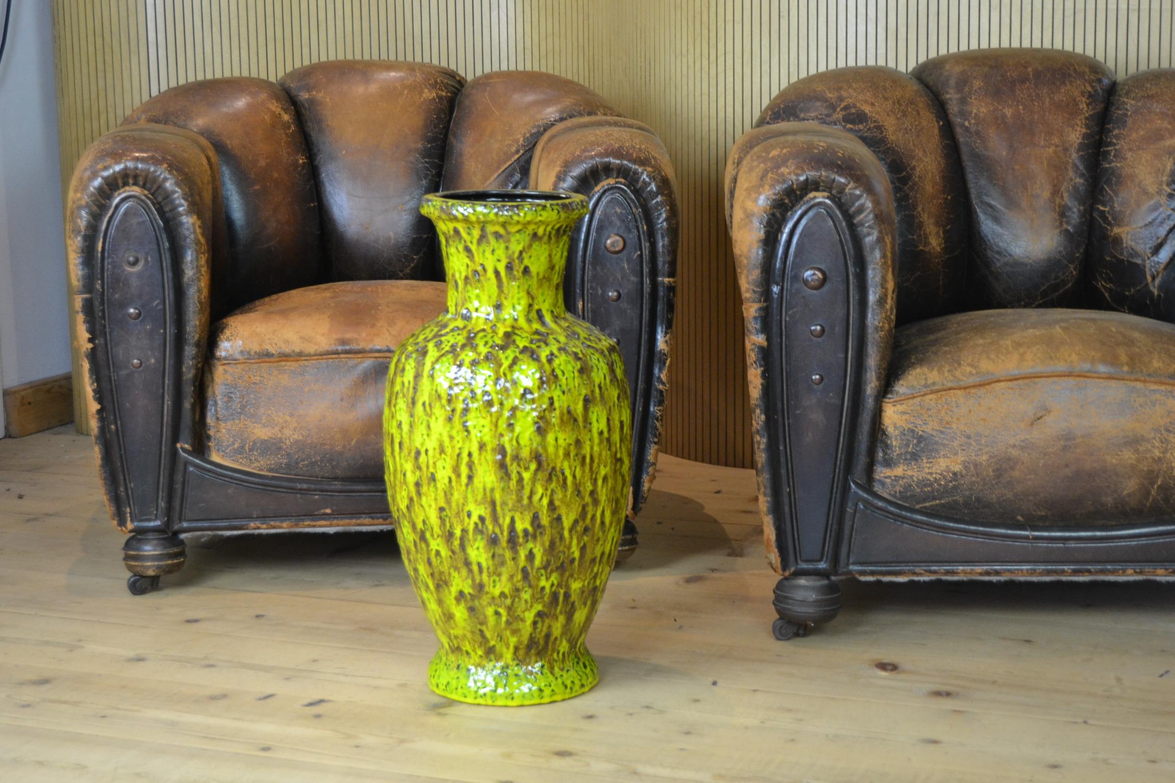 Large Vintage Fat Lava Ceramic Pottery Vase , Floorvase , Vessel 
made by Bay Keramik Western Germany. 
Numbered 571 - 60. 

This large Vase - Floorvase - Art Vase dates from the 1960s 
and has the colors yellow- green - brown. 
It's an eye