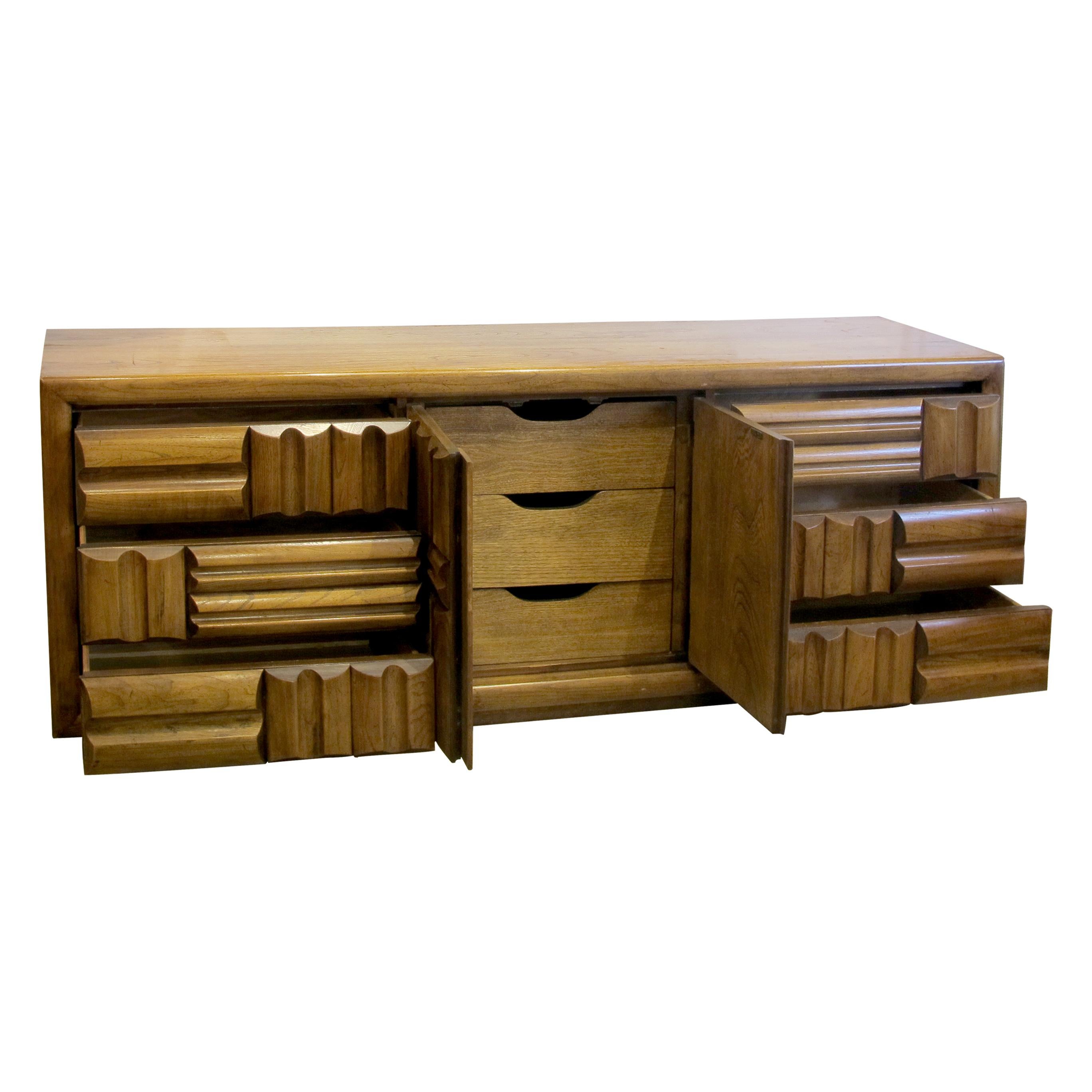 This Lane sideboard is a remarkable piece of furniture that embodies the distinctive characteristics of the Brutalist design. Manufactured by Lane, an esteemed American furniture company, this sideboard showcases the bold and unconventional