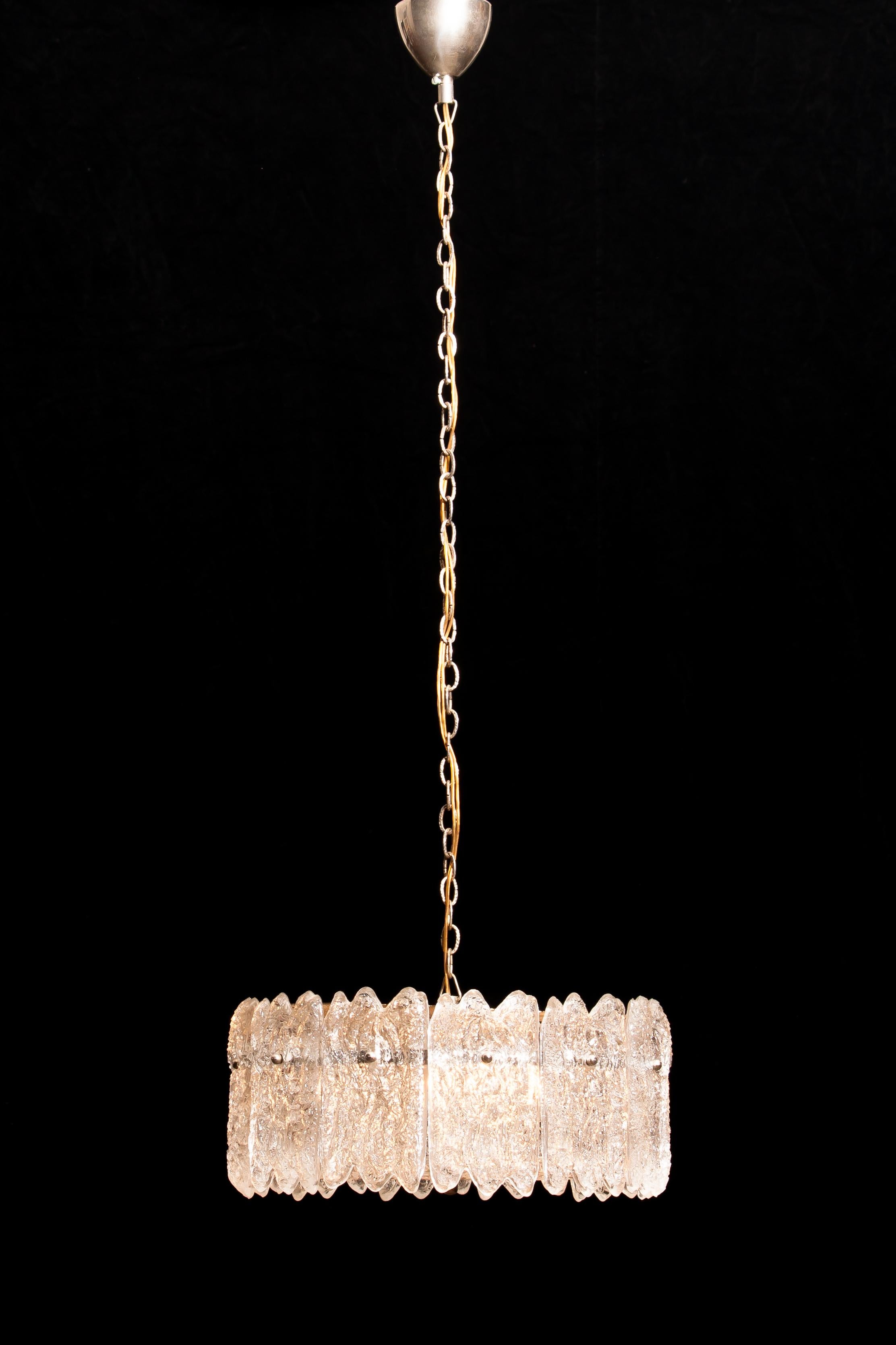 Very beautiful hanging lamp designed by Carl Fagerlund for Orrefors Sweden.
This lamp is build-up with lovely 'ice-sculptures' crystal elements.
The total height of the lamp is 105 cm but is adjustable to a shorter height.
It is in a wonderful