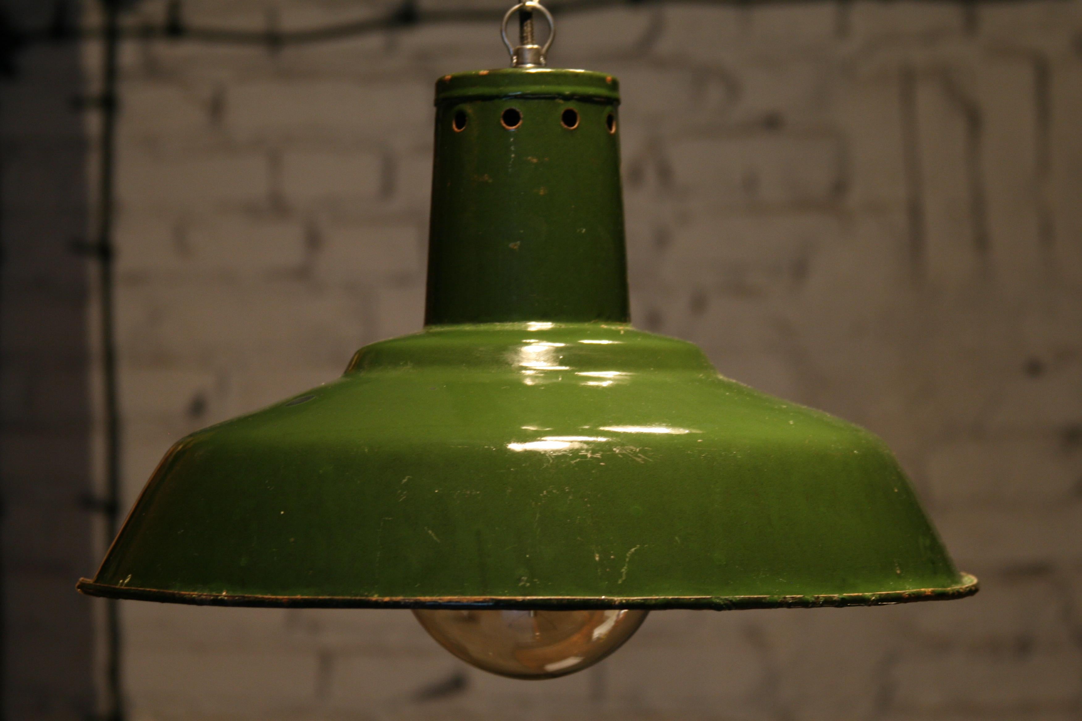 The original enamelled luminaire of Soviet production from the 1950s and 1960s.
Construction:
Three-part composite lampshade made of a deep pressed steel sheet, covered with two-colored enamel. The large diameter of the reflector guarantees an