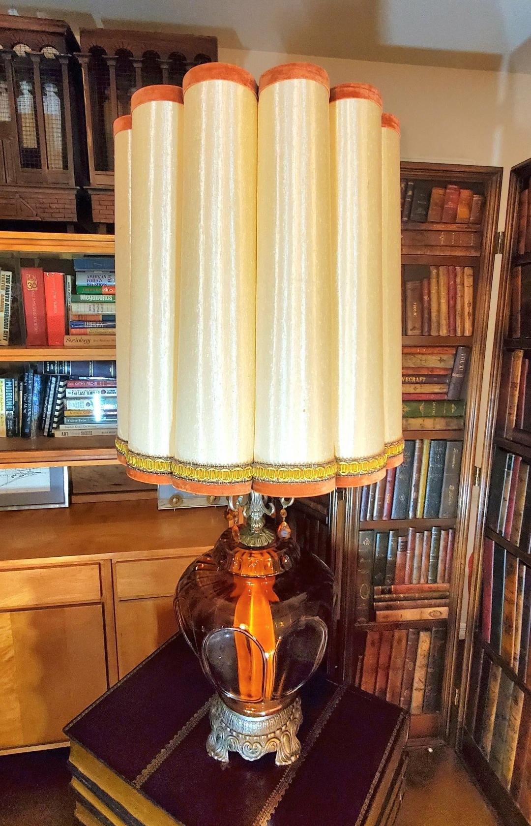 Monumental.
Massive amber glass Hollywood Regency table lamp.
Separate light inside amber glass.
Gorgeous fluted drum lamp shade.
Perfect functionality.
Art Deco.
Mid century modern.
35