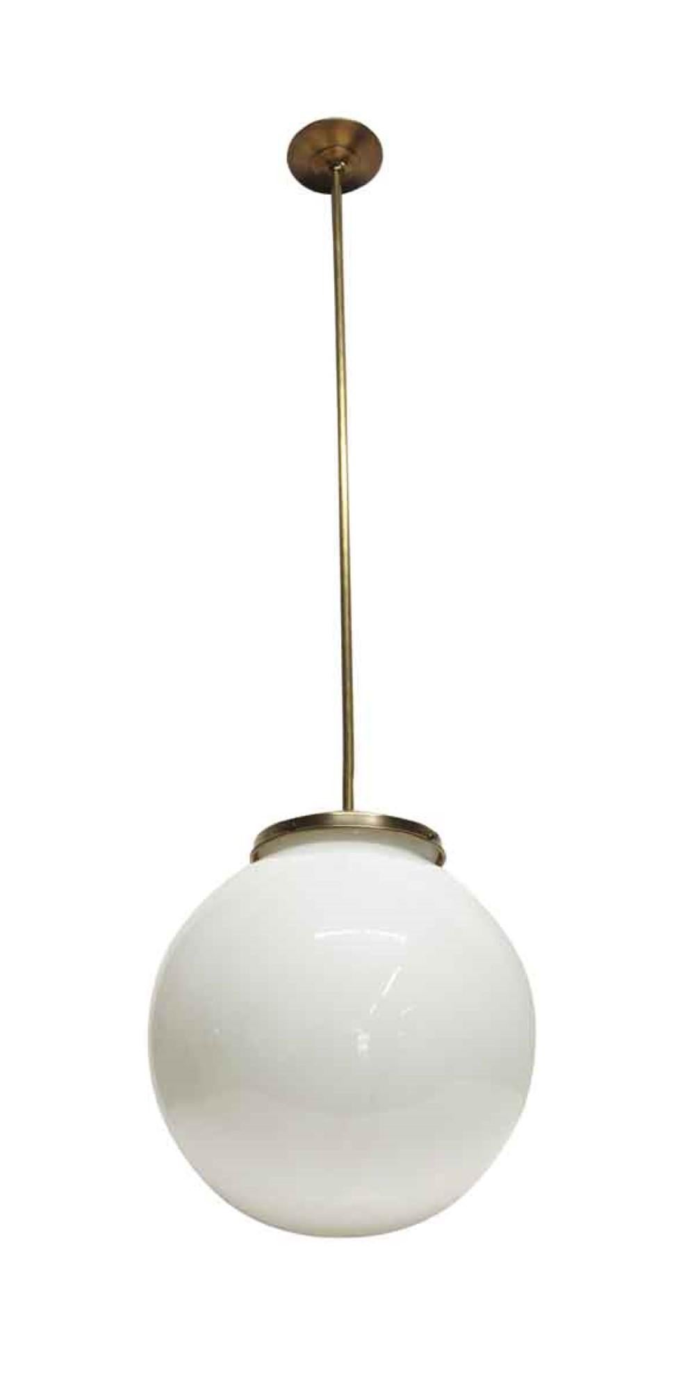 1960s Italian Mid-Century Modern spherical globe pendant light fixture. Featuring brass hardware. Small quantity available at time of posting. Please inquire. Priced each. Cleaned with new wire and socket. Please note, this item is located in one of