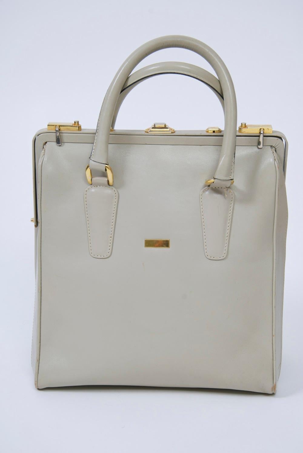 Oversized bone leather handbag by Rosina Ferragamo Schiavone, who was Salvatore's sister and who is primarily known for her striking shoe designs from the 1950s-1980s. This example, retailed by high-end shoe emporium, Joseph's, in Jacksonville, FL,