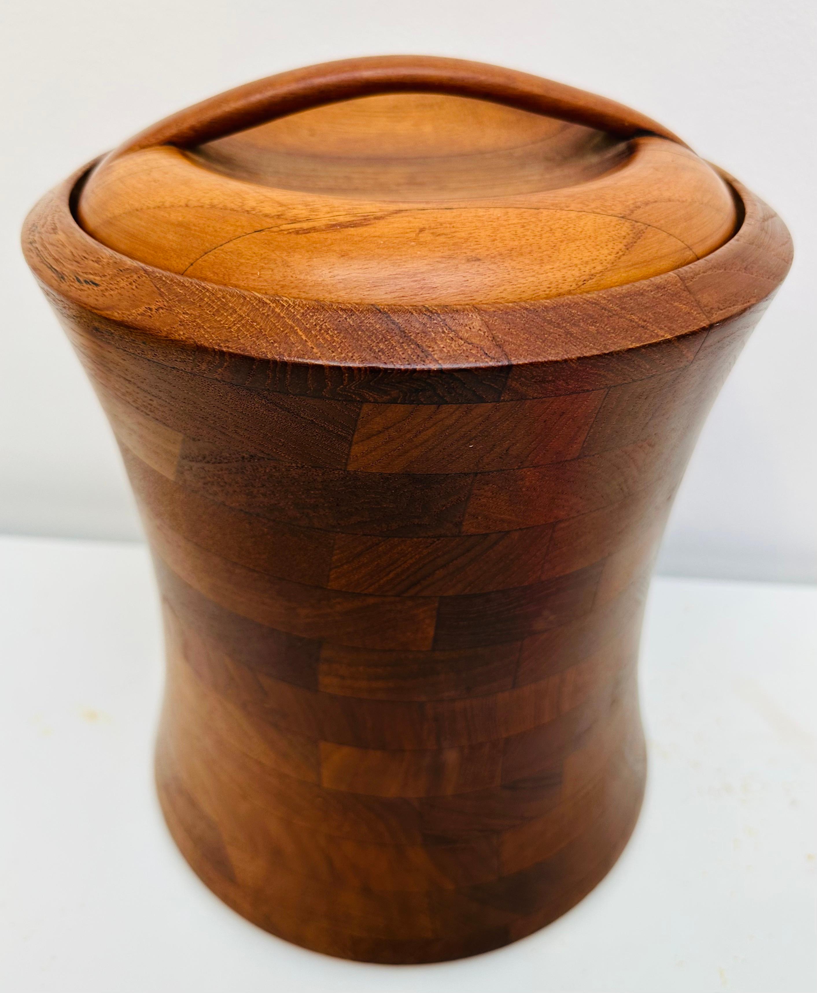 1960s Danish design large Teak ice bucket or wine cooler. The ice bucket is an elegant convex-shape, reminiscent of a power plant cooling tower, well-made and constructed. Its large size allows it to be fully functional and not just for show holding