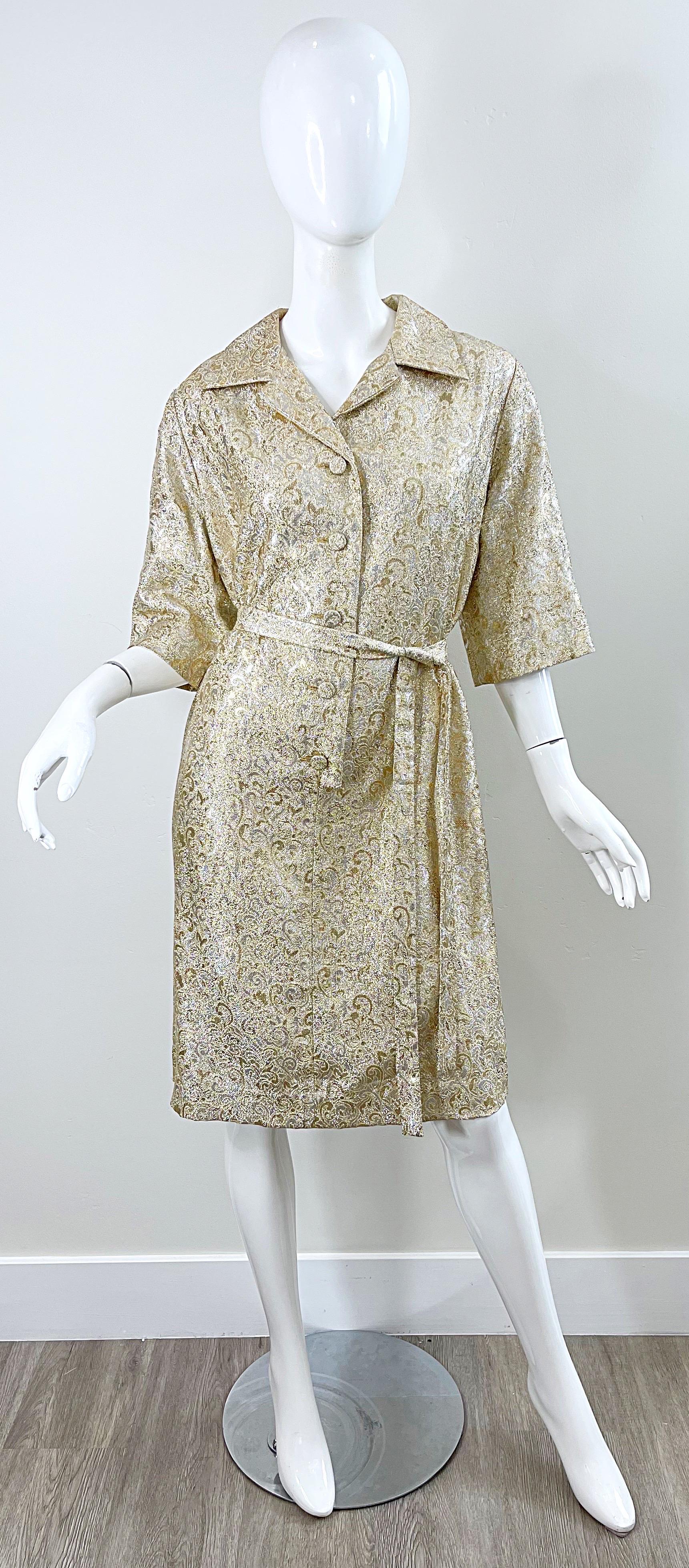 Chic 1960s larger size gold and silver silk brocade belted shirt dress ! Features 5 fabric covered buttons up the front. Detachable matching tie sash belt. Flattering 3/4 sleeves. Perfect for and day or evening event. Pair with sandals, wedges or