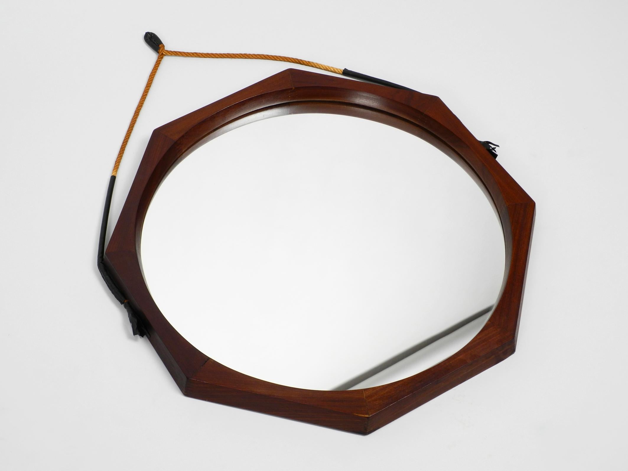 Original 1960s large beautiful wall mirror with a wide 8-square teak frame.
Made in Italy.
The original thick rope is made of jute or sisal, it is undamaged and firm.
Very high quality workmanship in a minimalist Italian design.
100% original