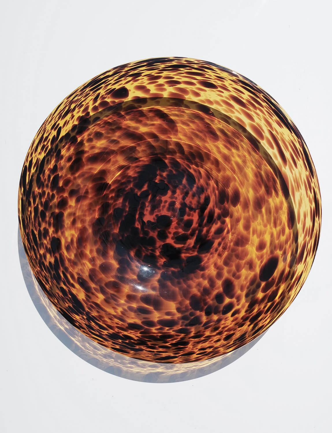 This incredible hand blown Tortoiseshell plate / centre piece was made in Empoli in the 1960s. Empoli, the historic town near Florence, has a long heritage of glass blowing dating back to the 13th century but came into fashion in the 1920s through