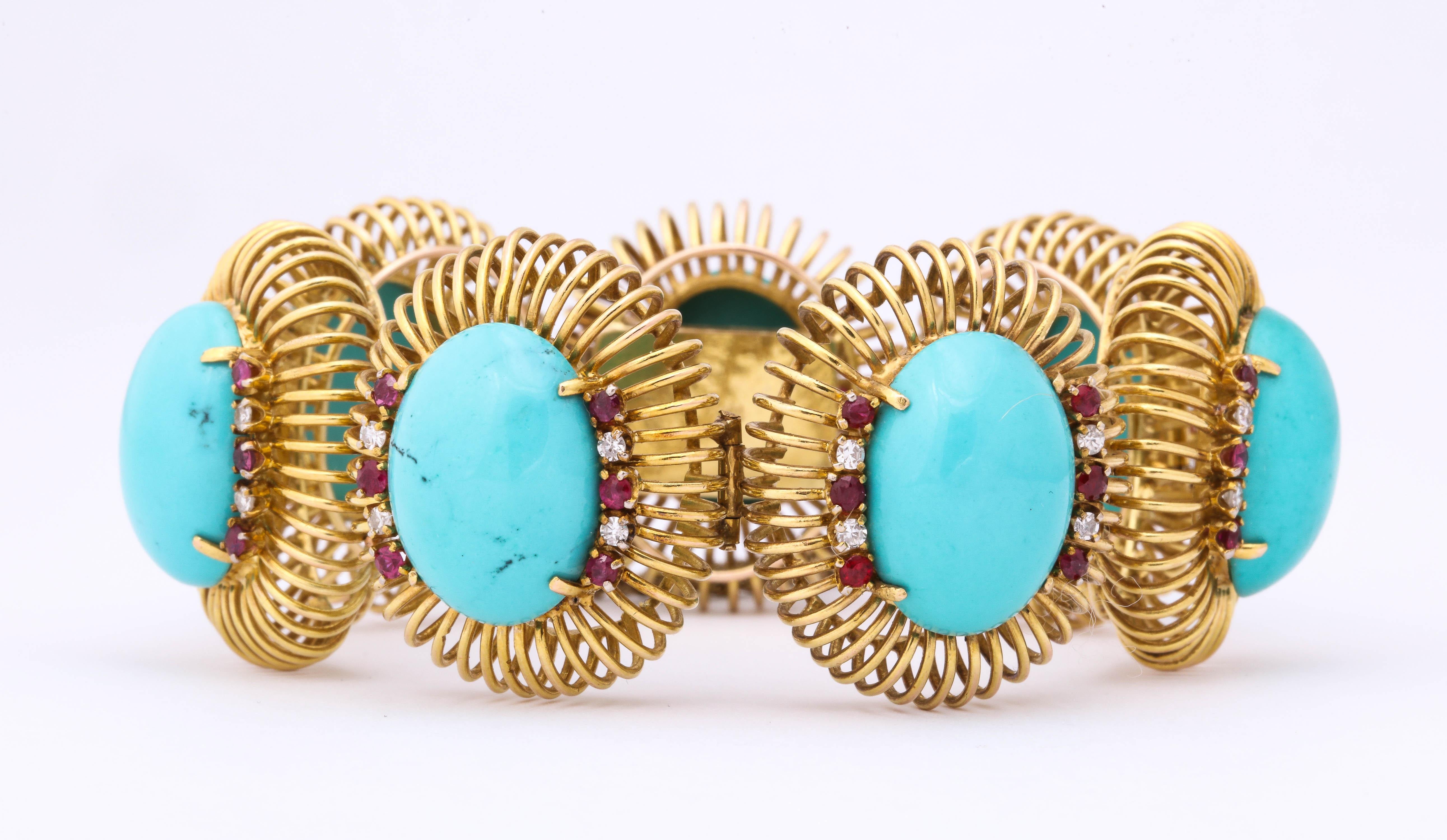 One Ladies 14kt Yellow Gold Open Wirework Link Bracelet composed of Seven 24mm cabochon sleeping Beauty Turquoises and accented with numerous faceted cut rubies and round diamonds.created in 1960’s in America  
