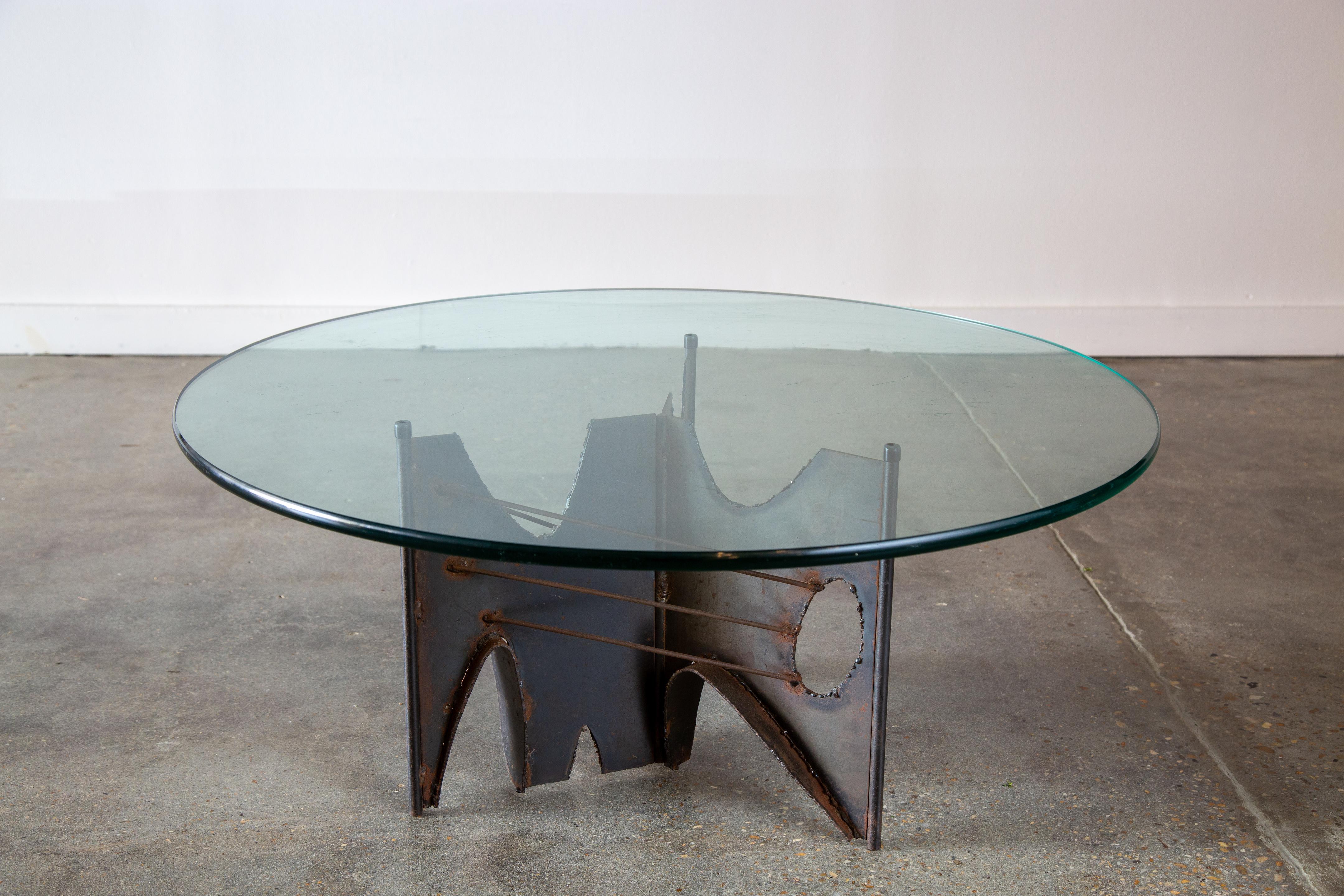 A vintage coffee table with a welded steel base and a glass top. Designed by Laurel’s primary designer’s Harold Weiss and Richard Barr with odes to Paul Evans welded brutalist designs.  This is a unique offering as we have only seen lamp bases with