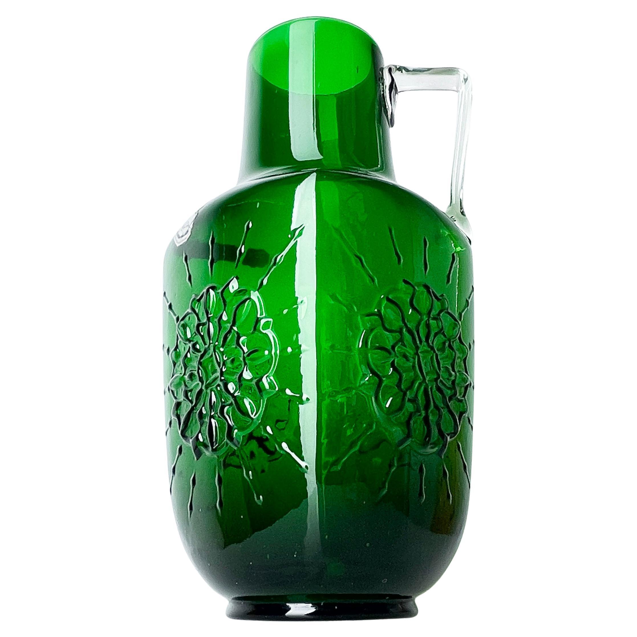 1960's Lavorazione a Mano emerald green glass handle vase from Italy. With Starburst relief motif. Original label reads: Mod. Depositato - Made in Italy. Fabricato in Toscana. 'Romantica'.
Made in Tuscany, Italy. Beautiful example of Italian mid
