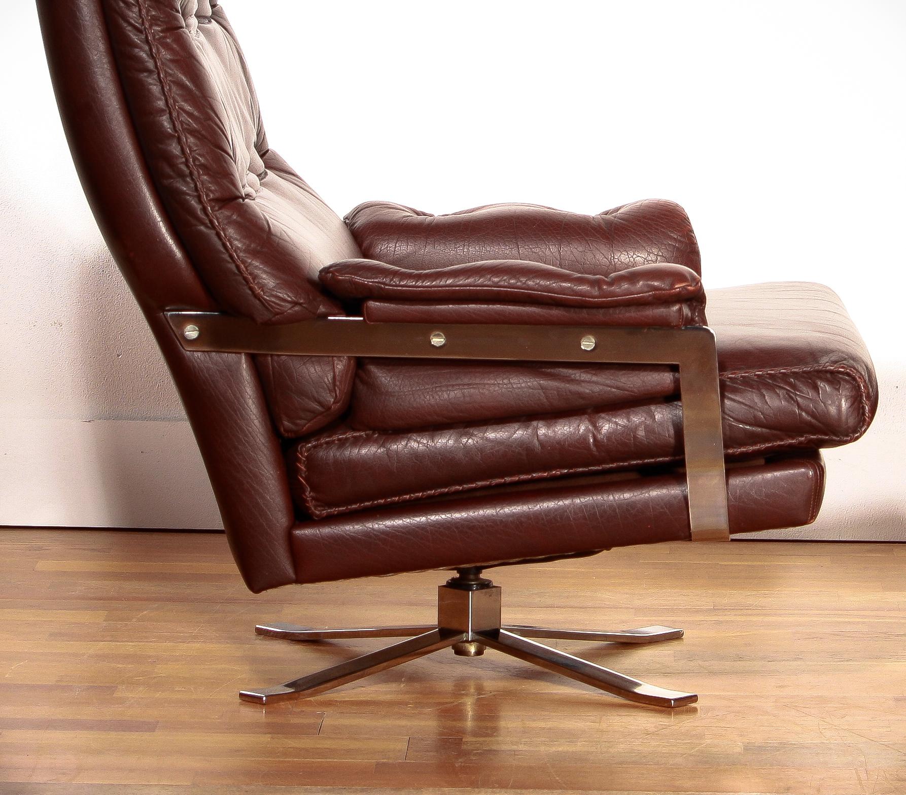 Mid-20th Century 1960s, Leather and Chrome Swivel Lounge Chair and Ottoman by Arne Norell