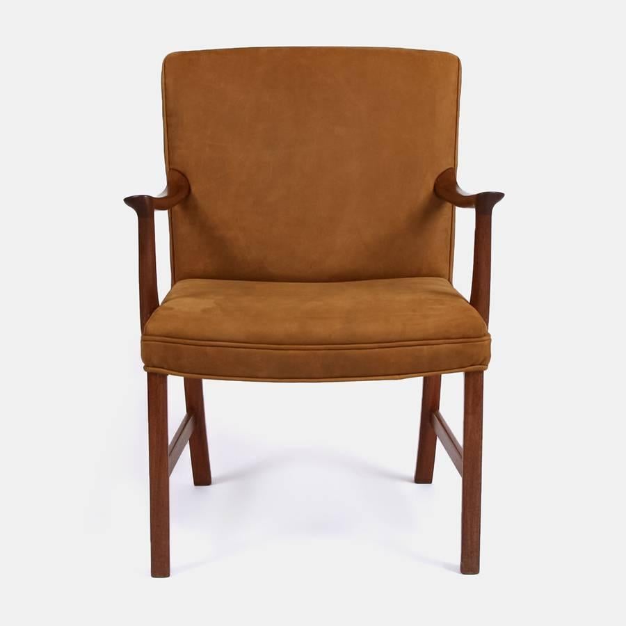 A 1960s Ole Wanscher chair re-upholstered in a buttery soft Andrew Martin tan leather.

Ole Wanscher (1903-1985), was born in Copenhagen in 1903 and was an architect and professor of architecture with furniture designs as his specialty. He came to