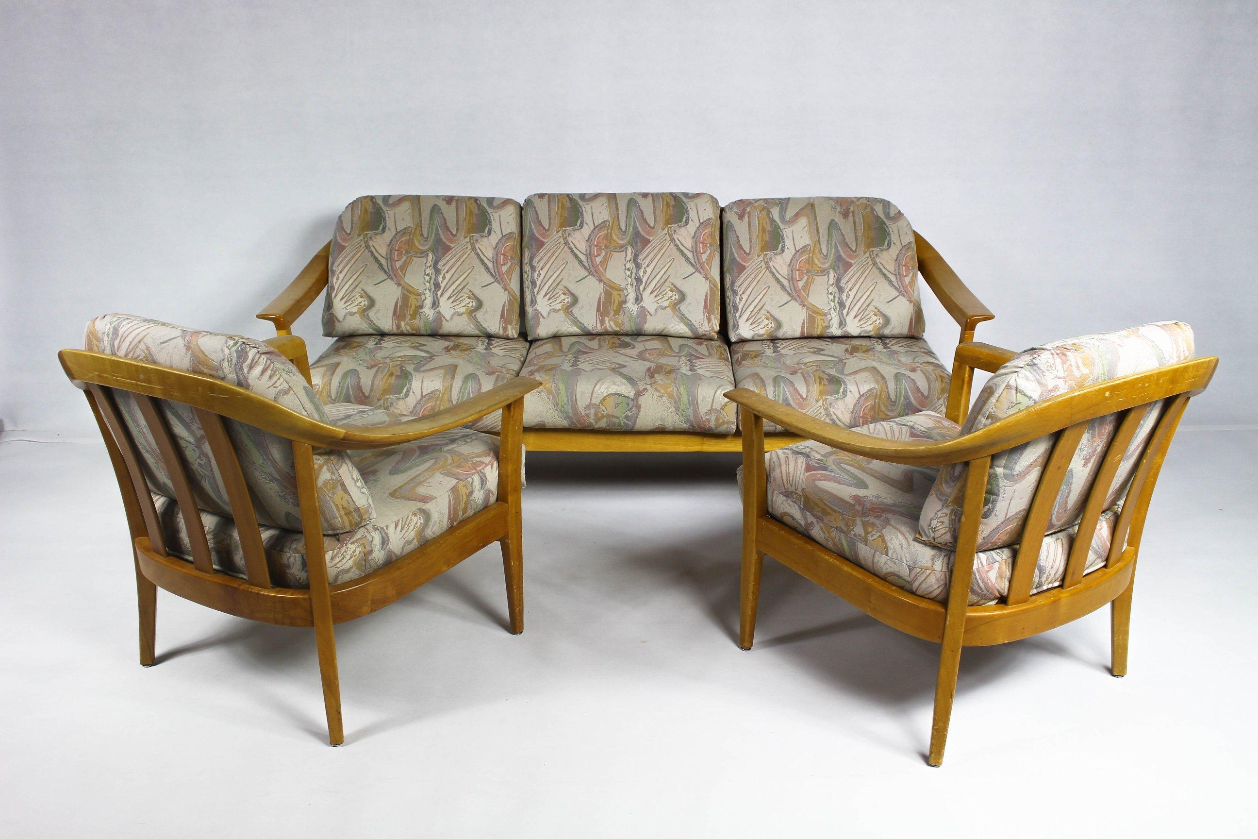 This set of sofa + pair of armchairs + coffee table was designed in 1960.
It features solid cherrywood, and loose-fitting cushions with patterned covers.
Measures: Sofa:
Length 190 cm Height 80 cm Depth 78 cm

Armchairs:
Length 77 cm Depth 60