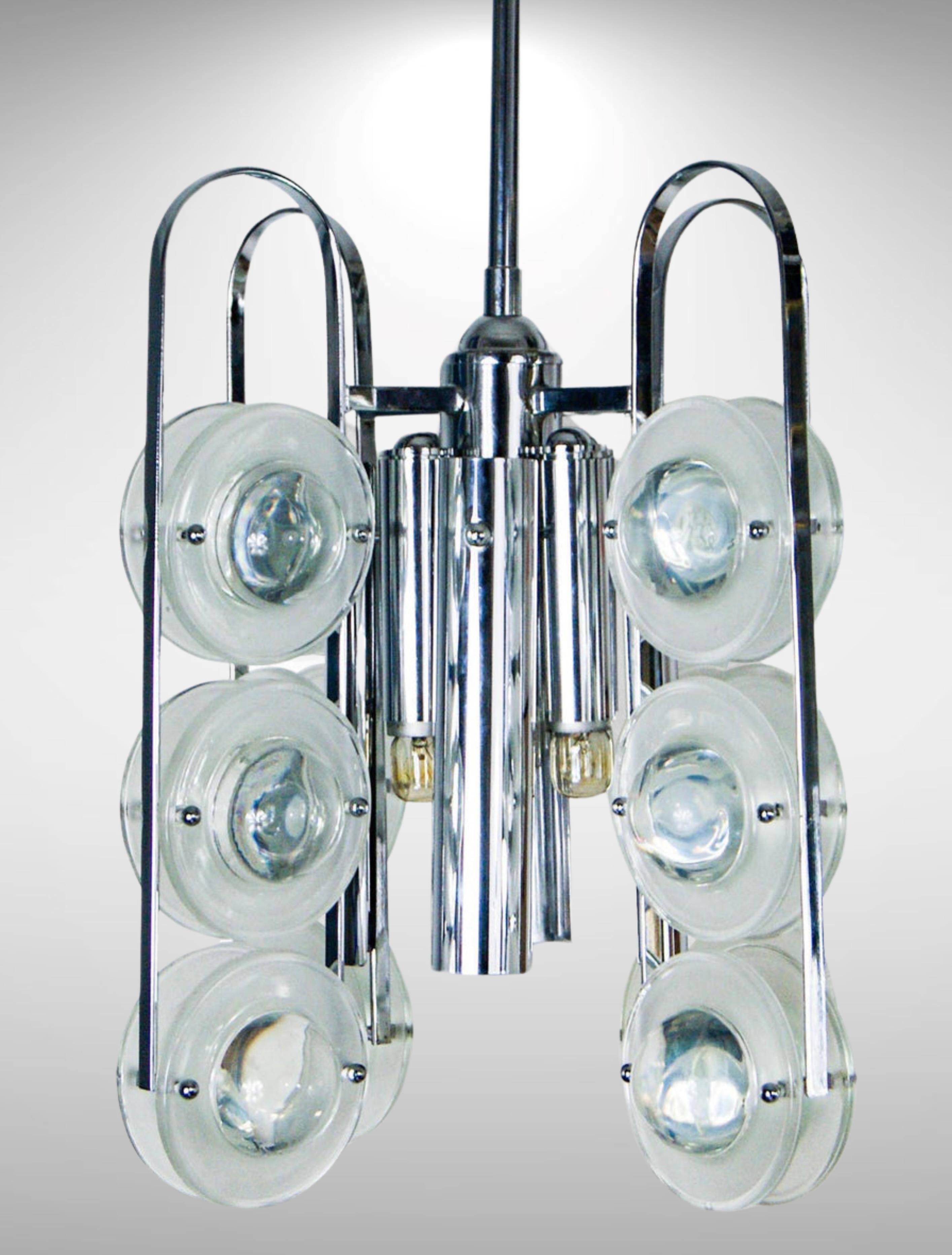 Mid Century Italian design Chandelier by Oscar Torlasco for Stilkronen.
Featuring Torlasco's signature lenticular glass discs as seen on 