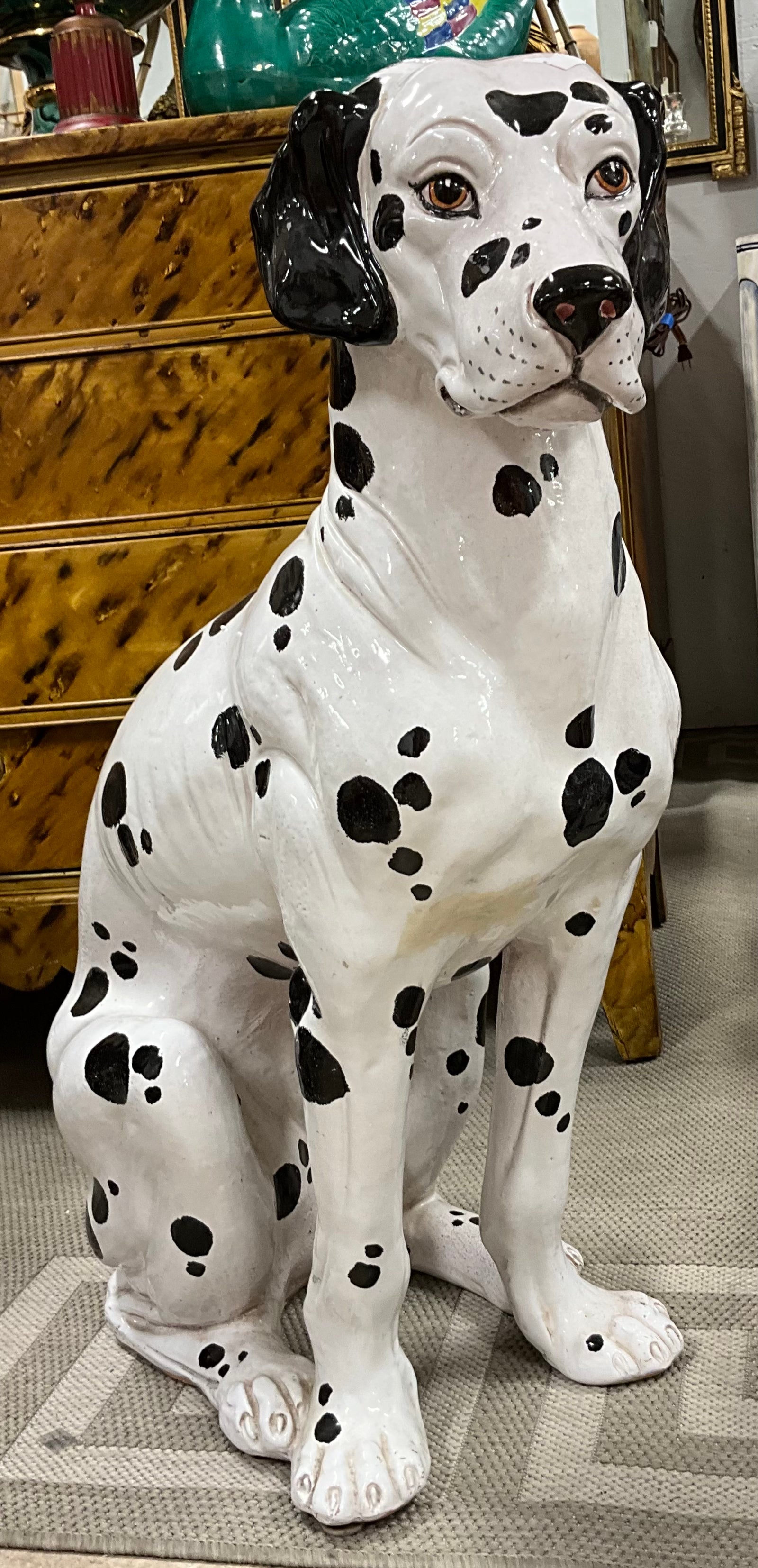 So fun! This is a 1960s life size Italian seated terracotta Dalmation. He has a wonderful black and white glaze! I love the soulful face!.
