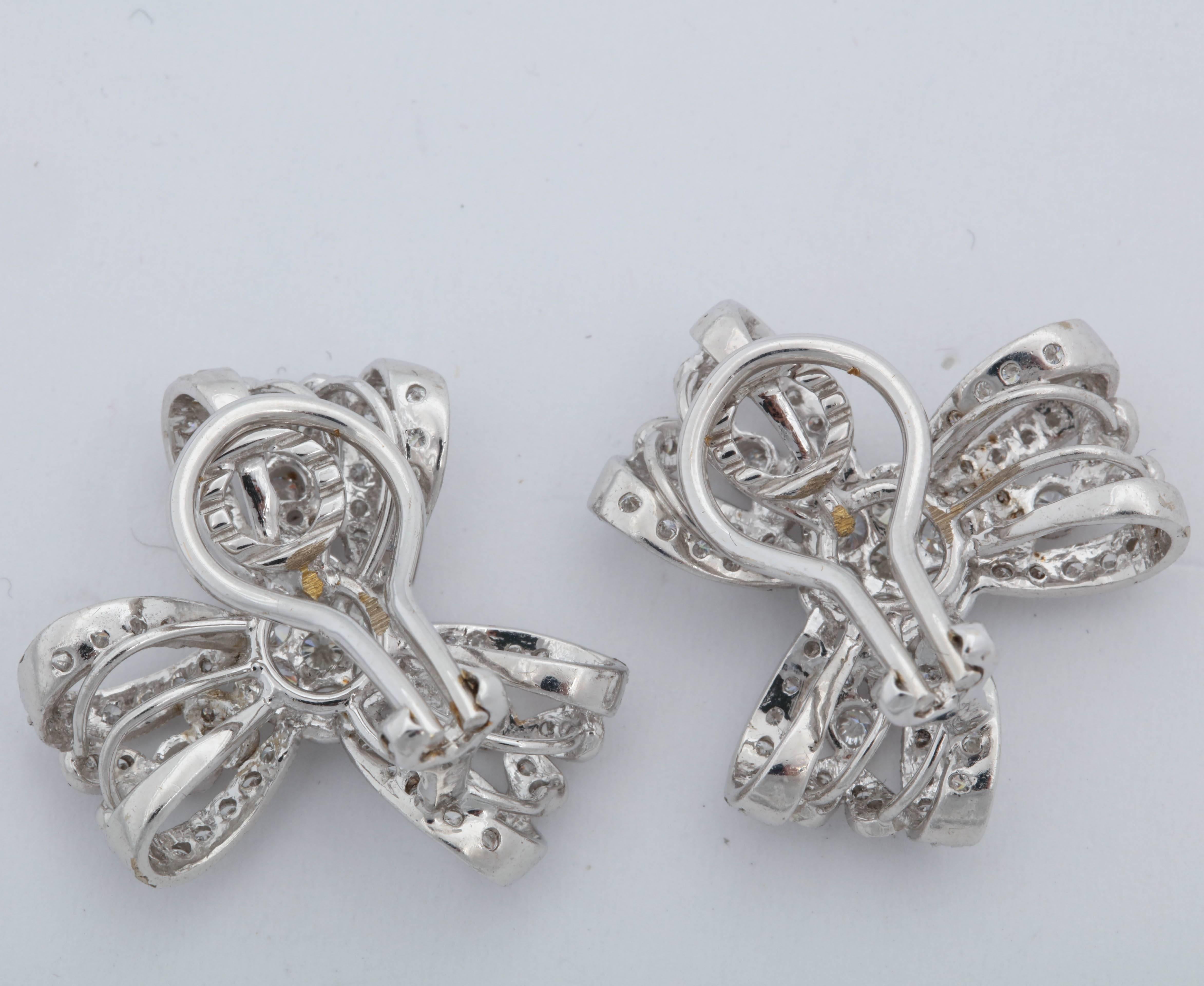 1960s Light and Airy Delicate Bow Knot Motif Diamond, White Gold Earclips In Excellent Condition In New York, NY