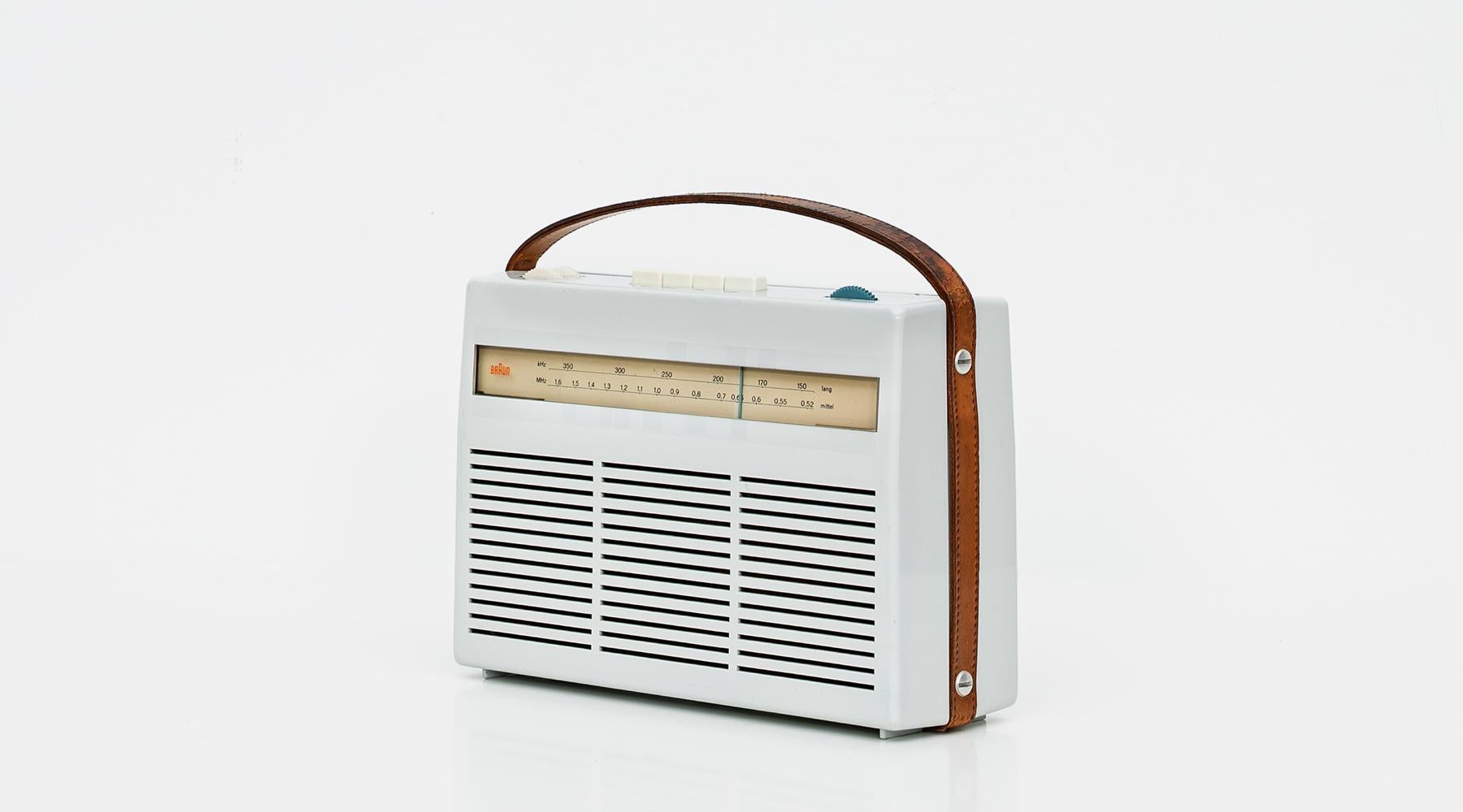 Portable radio T22, design made in Germany, original by Dieter Rams, 1960.

This wonderful example of portable radio T 22 by Dieter Rams is made of synthetic material with the original brown leather strap. The radio is in an exceptionally good and