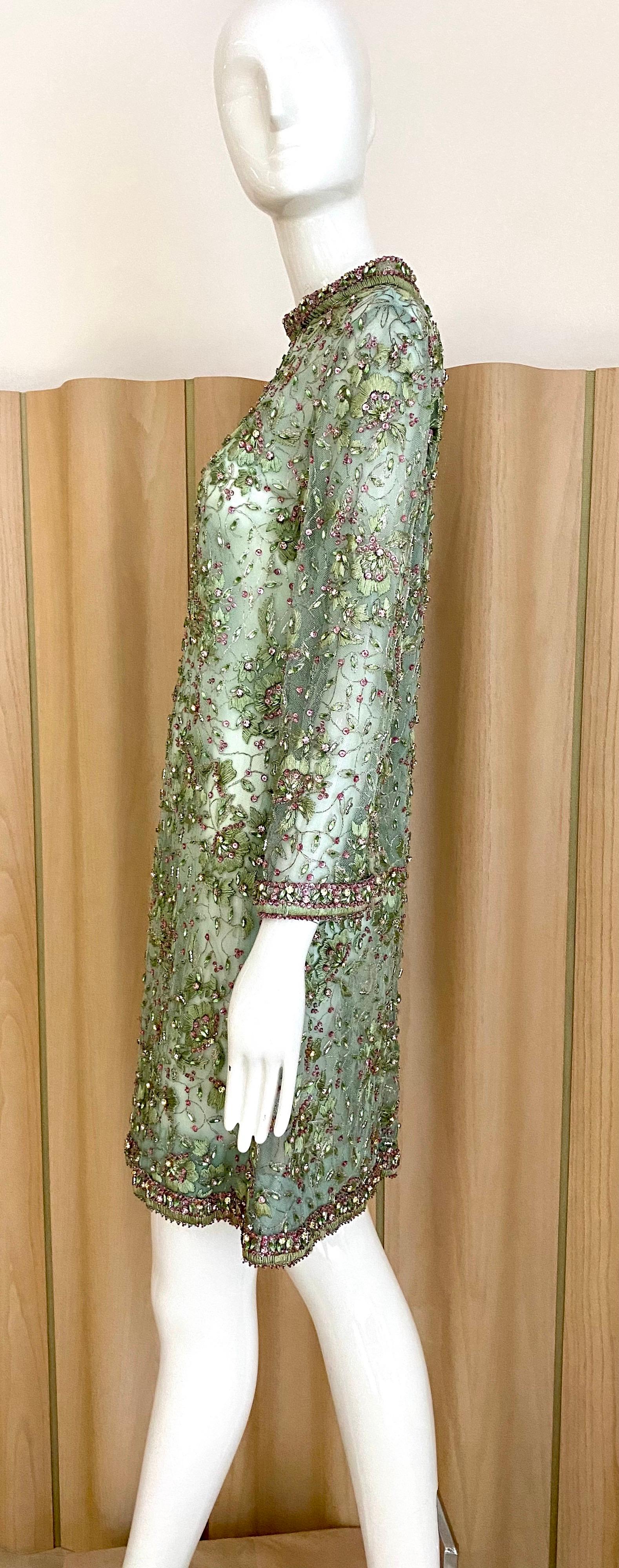 Beautiful Vintage 60s Light green mesh cocktail dress embellished with pink, green rhinestones on collar, sleeves and hem.  Perfect for wedding or cocktail party.
Size: Small 
Measurement: Shoulder: 15.5” 
Bust: 36” / Waist: 34” / Hip: 36” / Dress