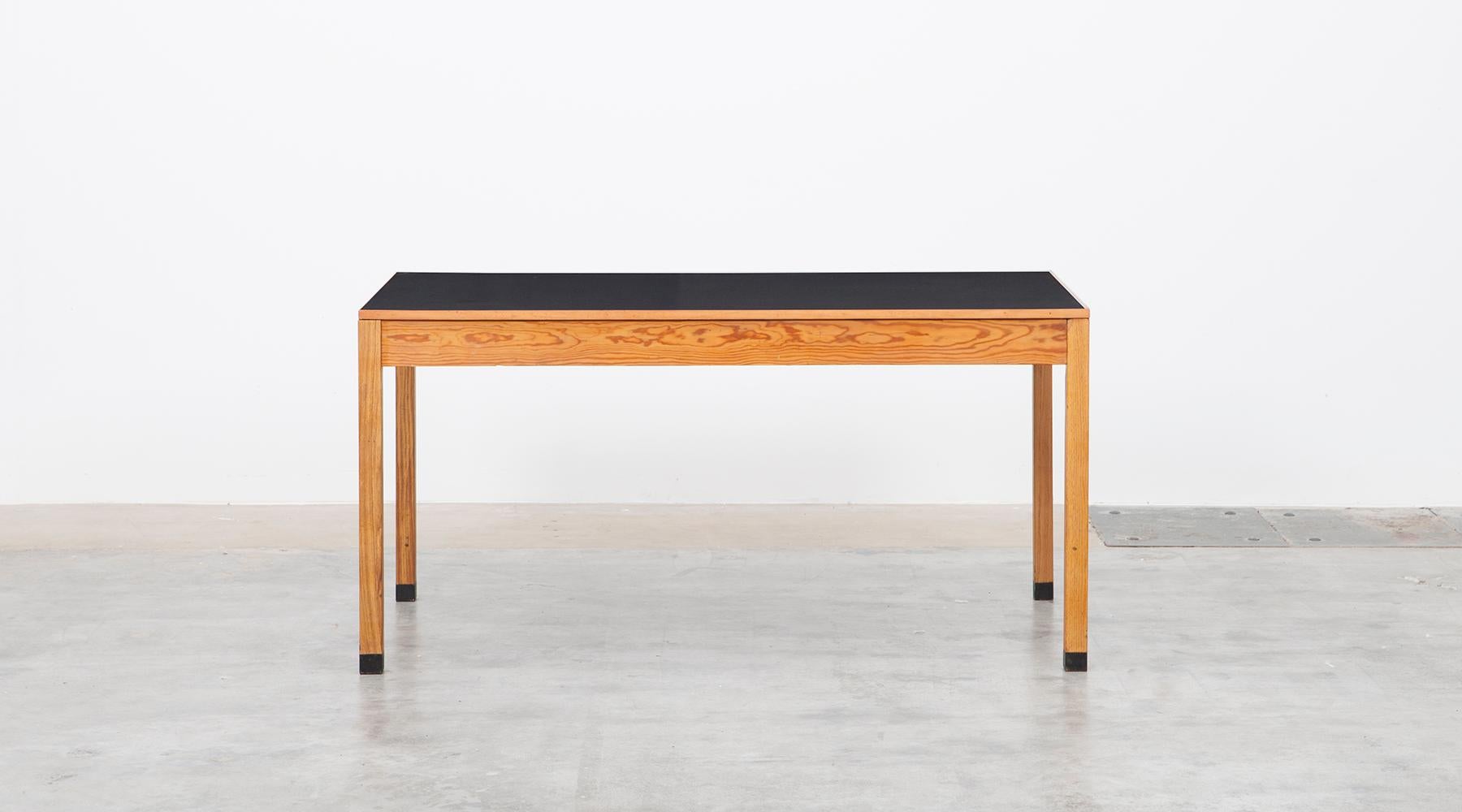 Useful Ferdinand Kramer table made of wood and linoleum top. This example comes in a comfortable size and pleasant width for fitting in every corner. We have more tables in this style in stock, with differences in length. All examples are from