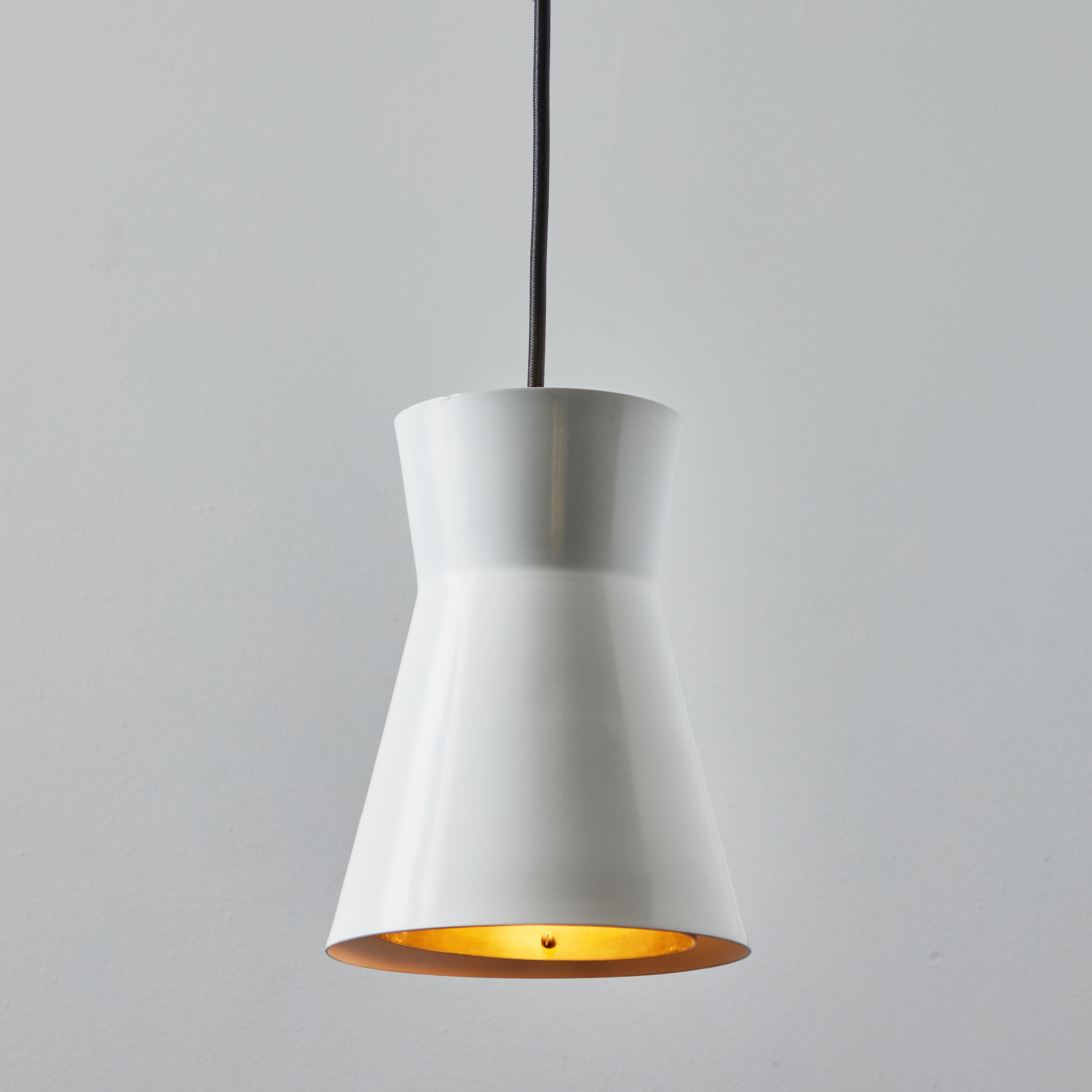 1960s Lisa Johansson Pape Model #61-362 Brass & Metal Pendant for Stockmann Orno. Executed in white painted metal and polished brass. An incredibly refined piece that is quintessentially Finnish in its conception and execution.

A contemporary of