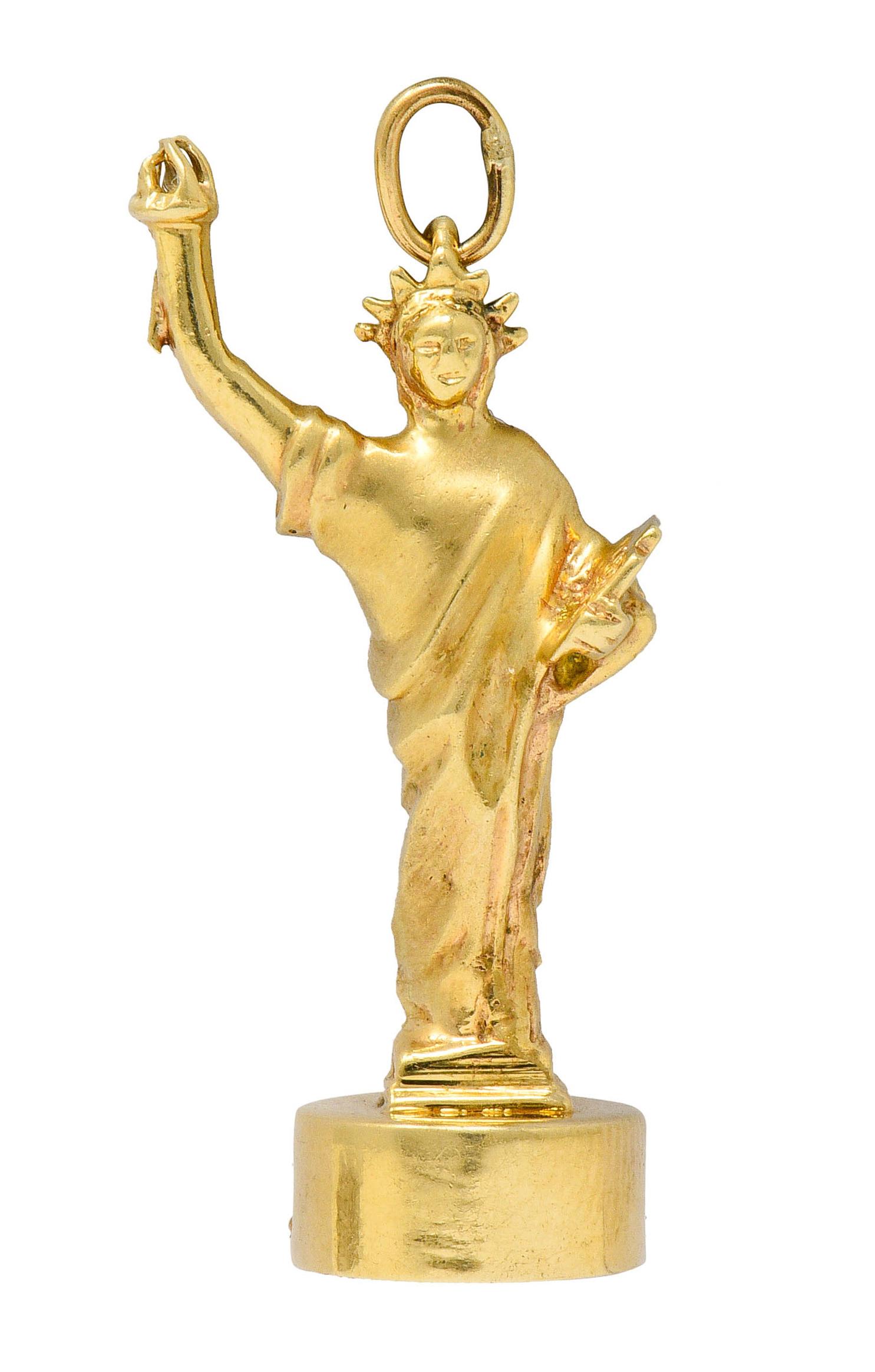 Substantial charm is designed as the iconic New York Statue of Liberty

Garments realistically drape and have a fine satin finish

Raised arm holds torch that light up when bottom of the charm is pressed

Fully signed Litacharm Inc.

Stamped 14K for