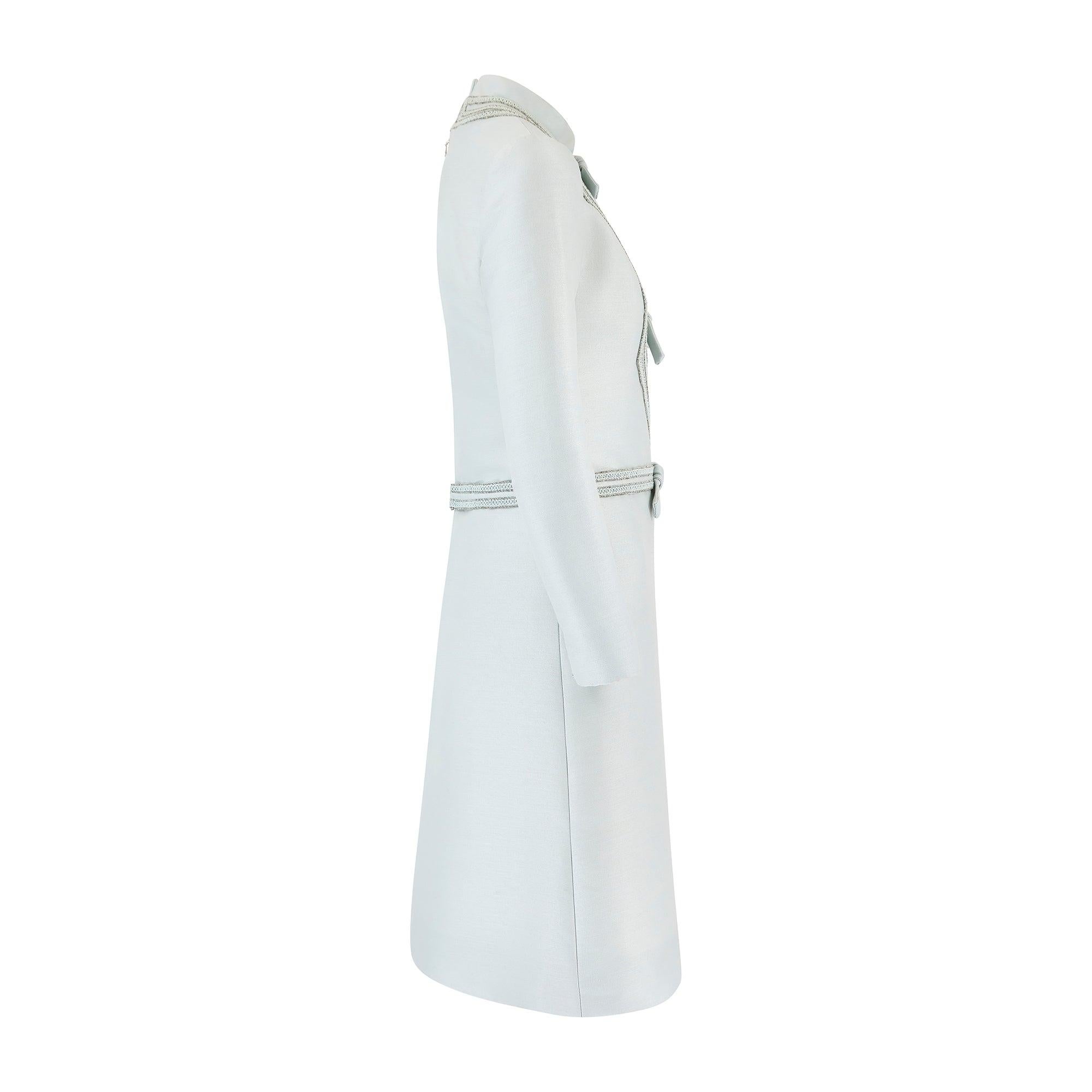 This magnificent dress was designed by French fashion house Louis Féraud for British store Rembrandt during the 1960s.  Made in England, it is crafted from matte silk-look fabric in a breathtaking, pale duck egg blue shade. Cut to a deceptively
