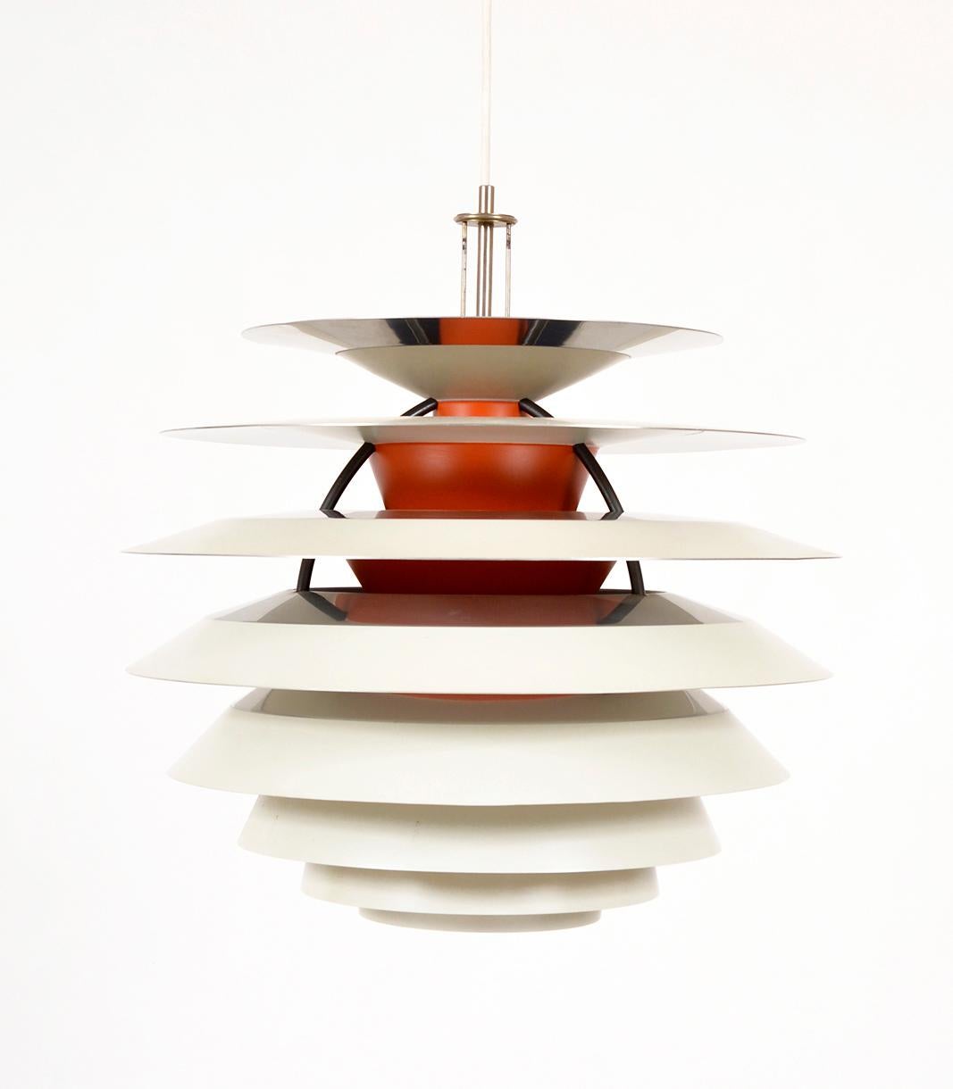 This iconic 1960s “Kontrast” pendant lamp was designed by Poul Henningsen for Louis Poulsen. Henningsen began his collaboration with Copenhagen-based lighting company Louis Poulsen in 1925, and produced over one hundred lamps, all belonging to the
