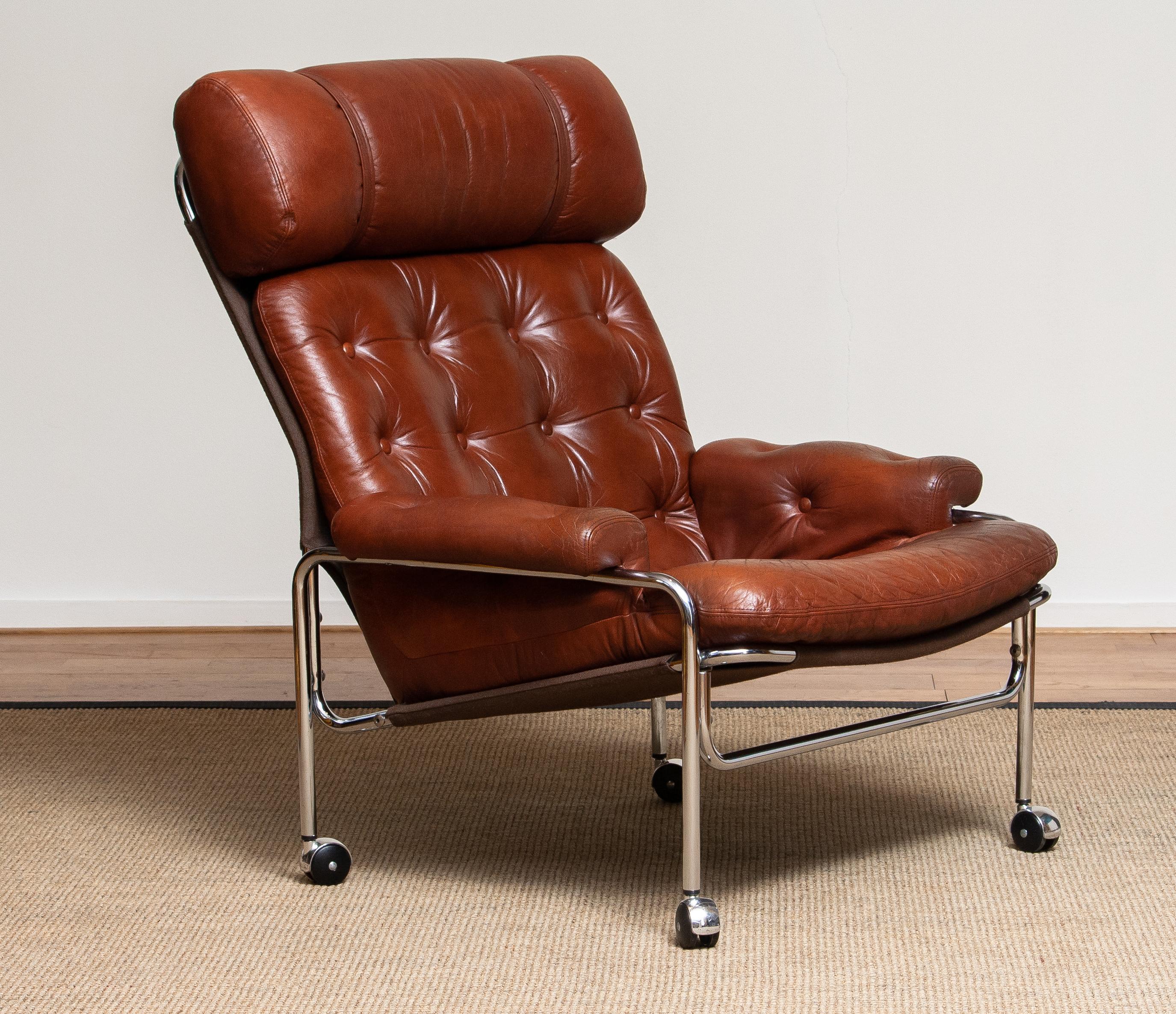 Swedish 1960s Lounge / Easy Chair in Chrome and Aged Brown / Cognac Leather by Lindlöfs
