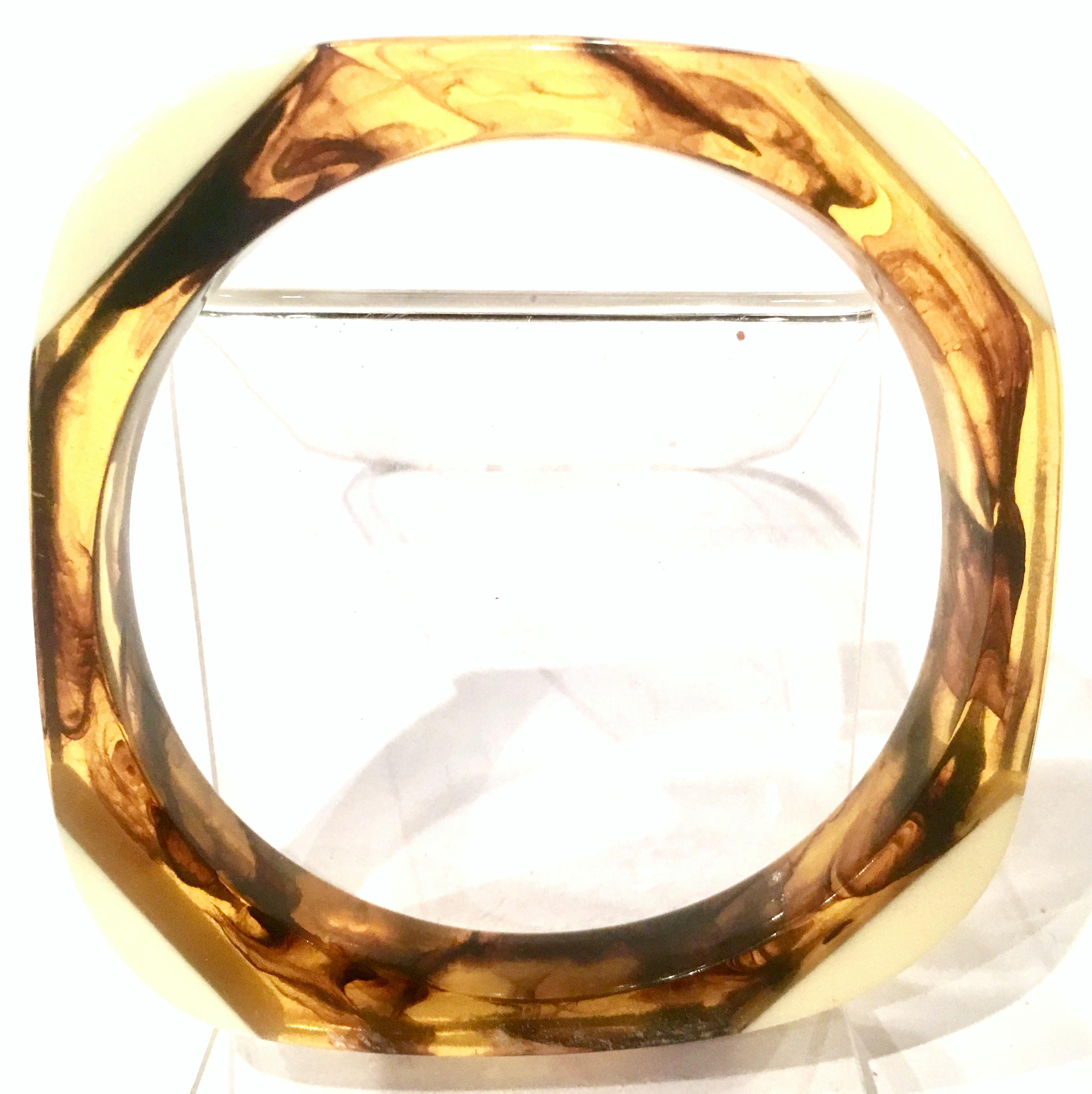 Mid-20th Century Lucite Faux Ivory & Tortoise Shell Square and Round Bangle Bracelet. This rare and coveted shaped bracelet features Lucite faux ivory with tortoise shell. Interior diameter measures, 2.5