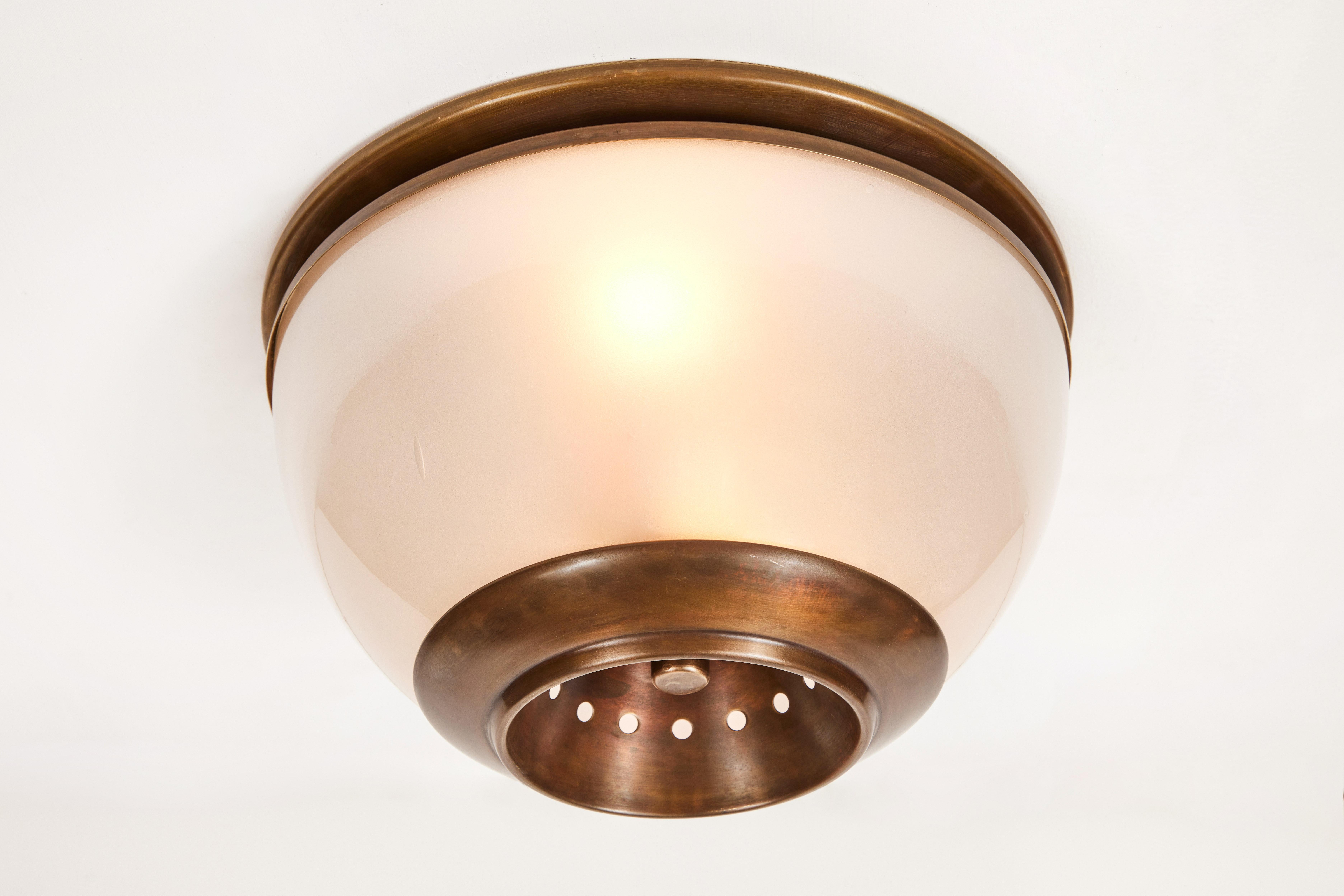 1960s Luigi Caccia Dominioni LSP3 ceiling or wall light for Azucena. Executed in blown opaline glass and patinated brass. 

Azucena was one of the most innovative lighting design companies in Italy during the midcentury era. Their designs have