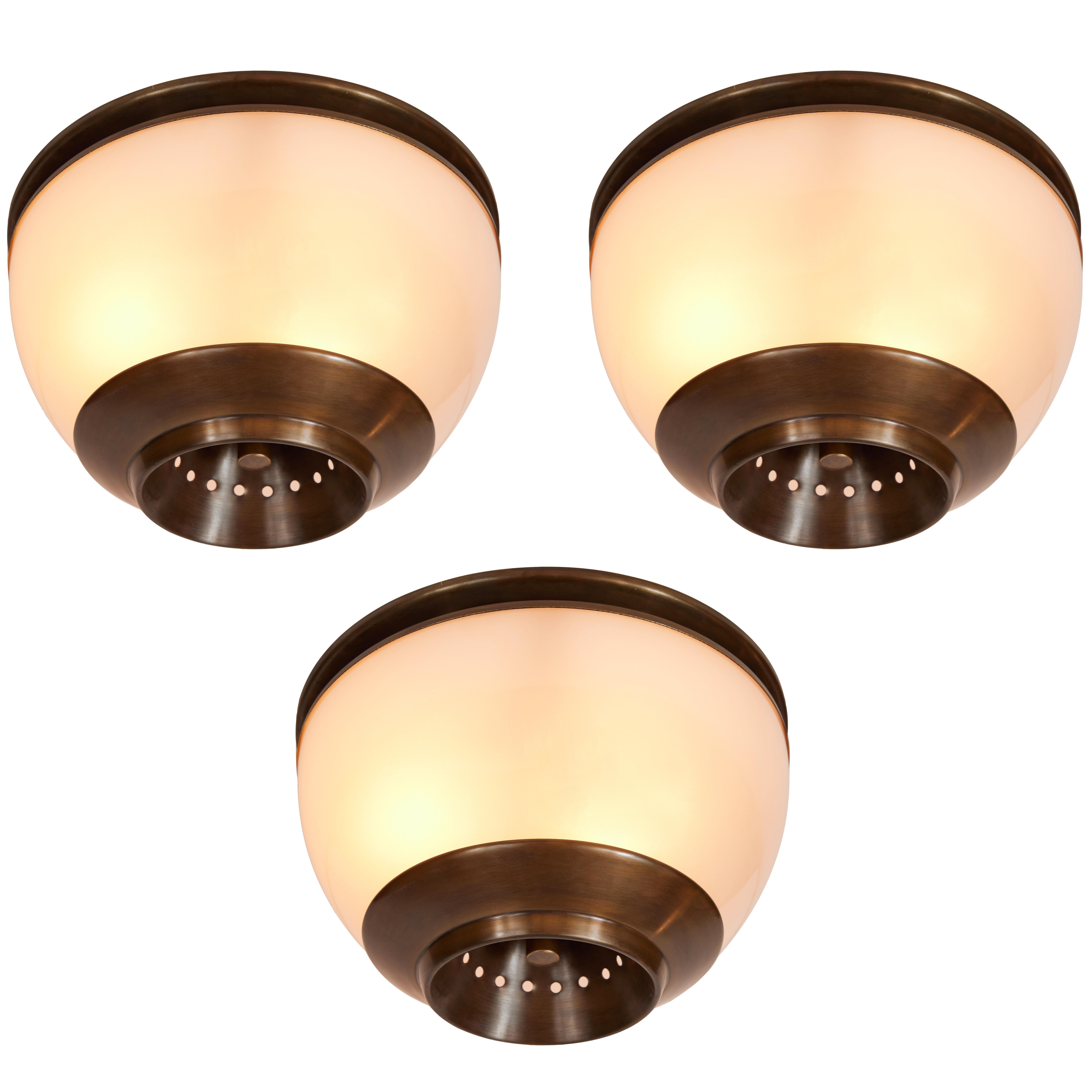 1960s Luigi Caccia Dominioni LSP3 ceiling or wall light for Azucena. Executed in blown opaline glass and patinated brass. 

Price is per item. 3 lamps available. Also available in a larger size.

Azucena was one of the most innovative lighting