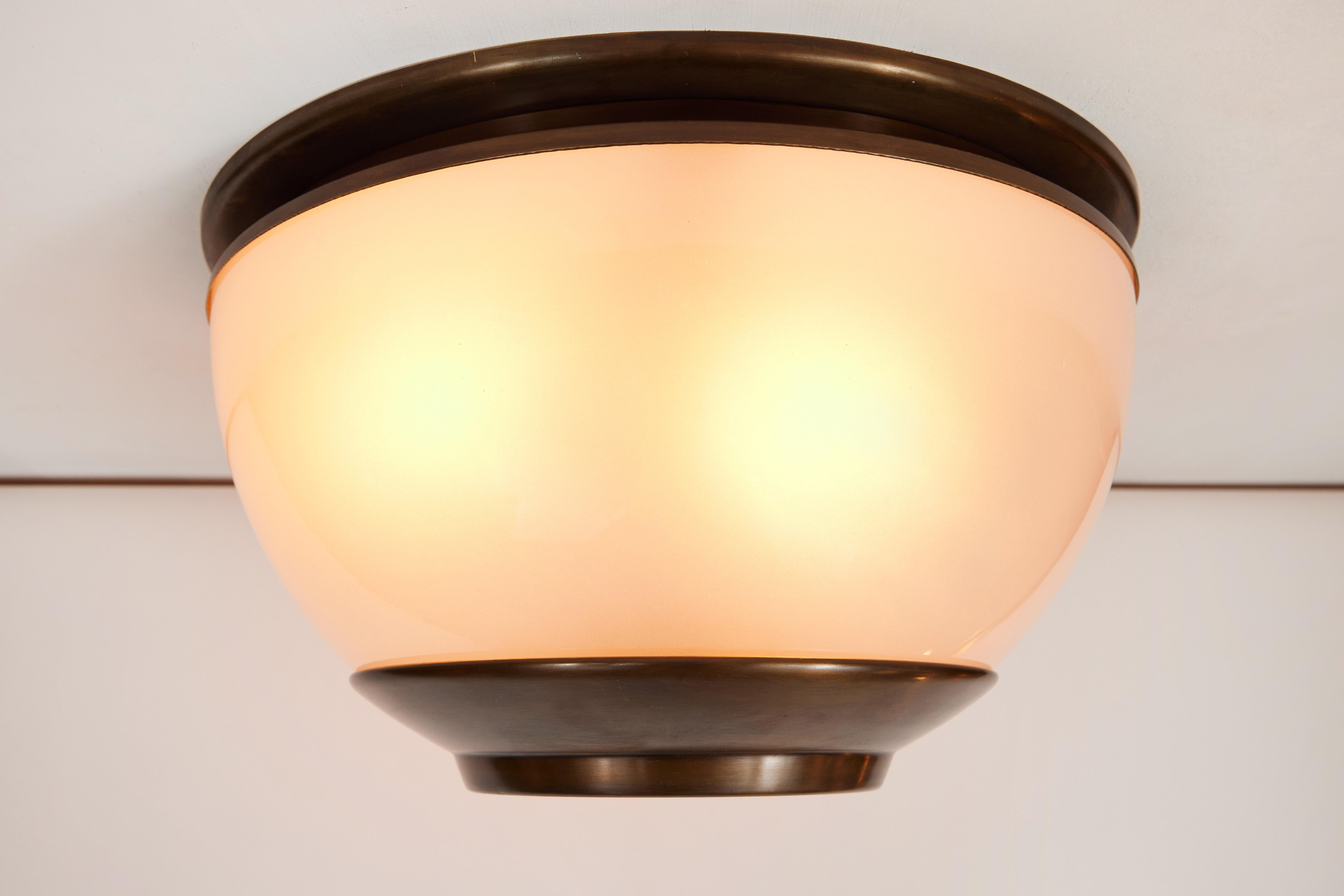 1960s Luigi Caccia Dominioni LSP3 ceiling or wall light for Azucena. Executed in blown opaline glass and patinated brass. 

Azucena was one of the most innovative lighting design companies in Italy during the midcentury era. Their designs have been