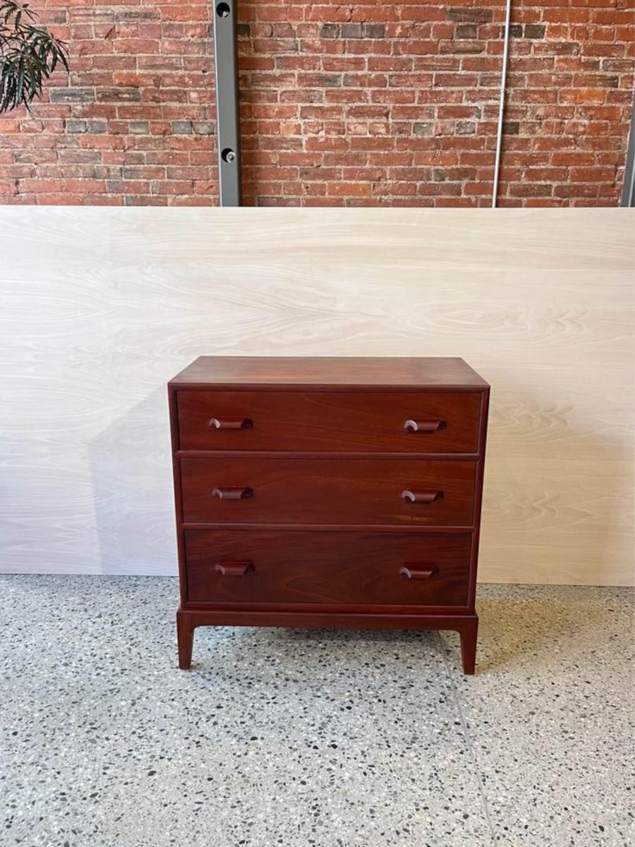 We are thrilled to present this elegant mahogany dresser, featuring a rich grain and inviting tone. The uniquely curved handles add uniqueness while the dovetail joinery showcases a high level of craftsmanship. Slightly angled legs contribute a