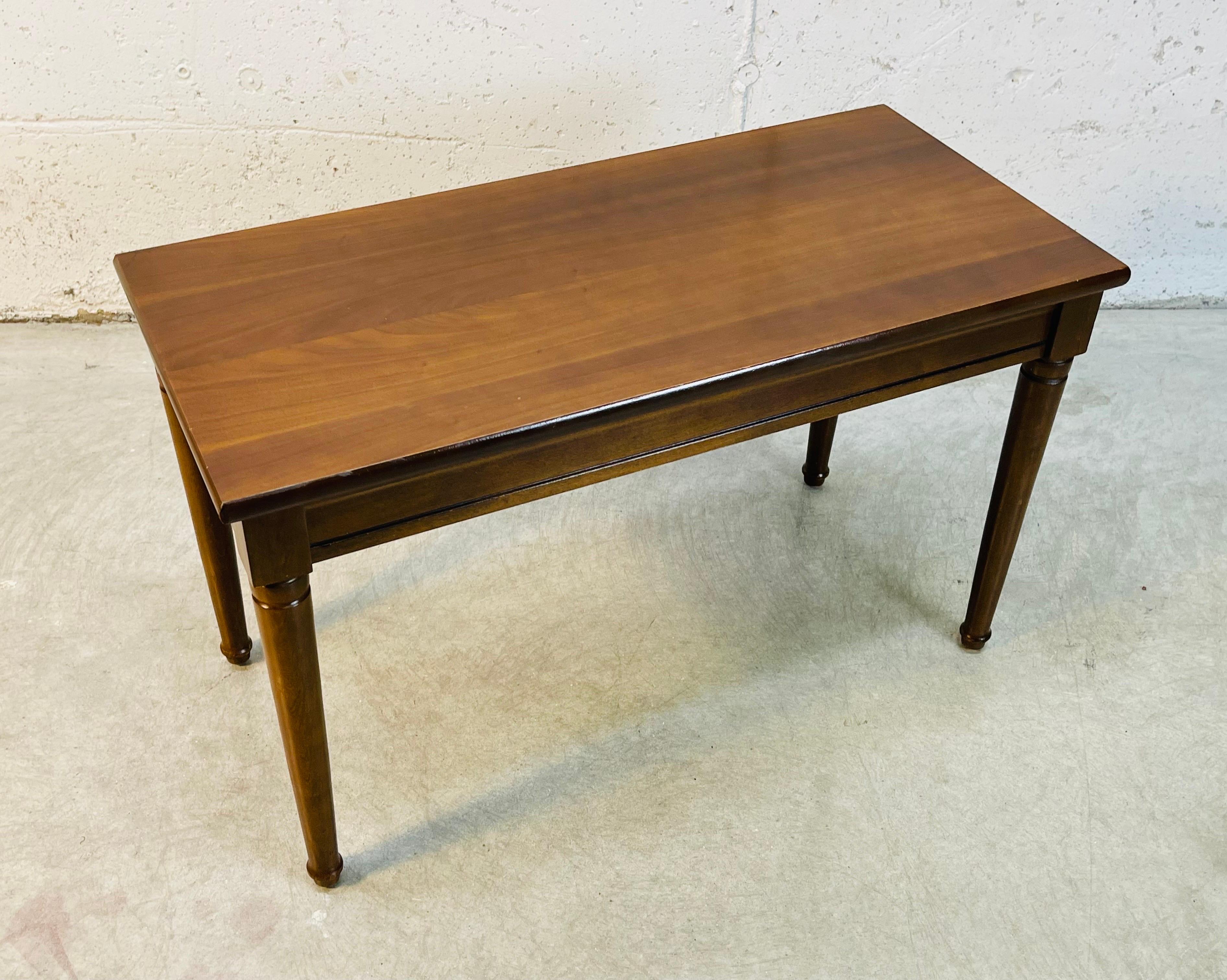 Vintage 1960s rectangular mahogany wood piano bench with storage for sheet music. The seat lifts for storage. The bench is solid and sturdy. No marks.