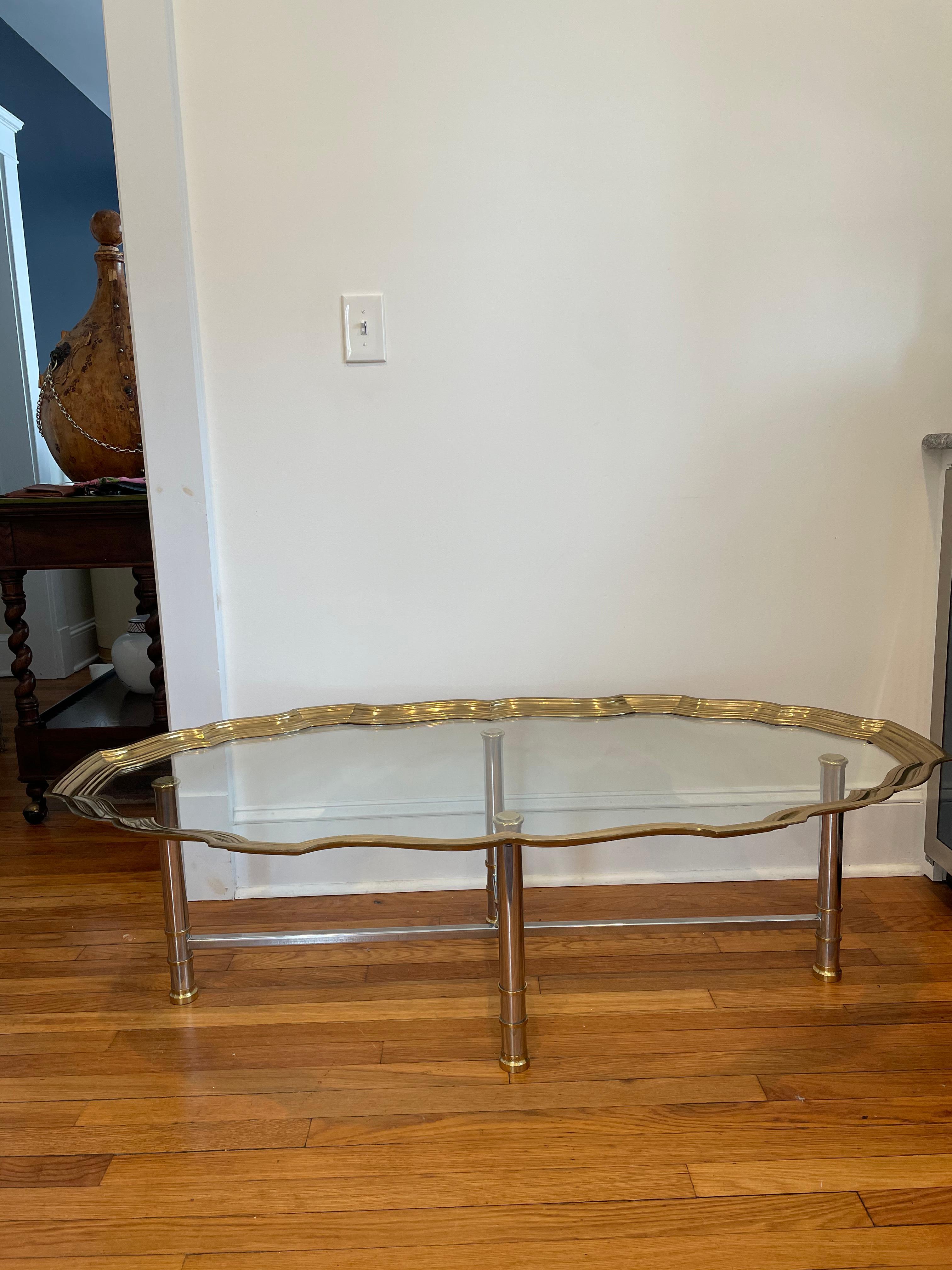 Unique classic chrome and brass directorie style coffee table with ornate brass tray top glass in the manner of Maison Jansen.