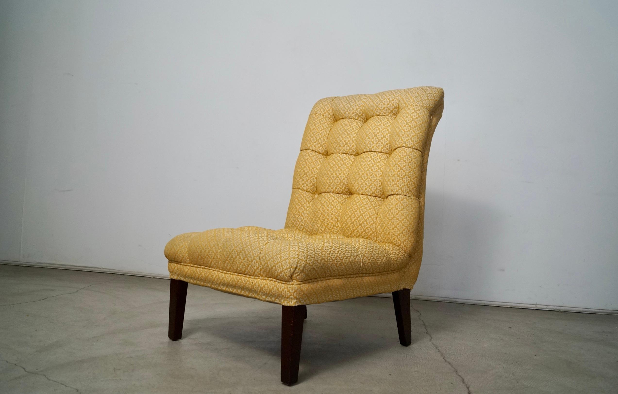 Vintage 1960's Hollywood Regency tufted slipper chair for sale. Really solid chair with a great curled scoop design, and has angled tapered legs in a walnut finish. The upholstery is in outstanding condition with no rips, tears, or stains, and has