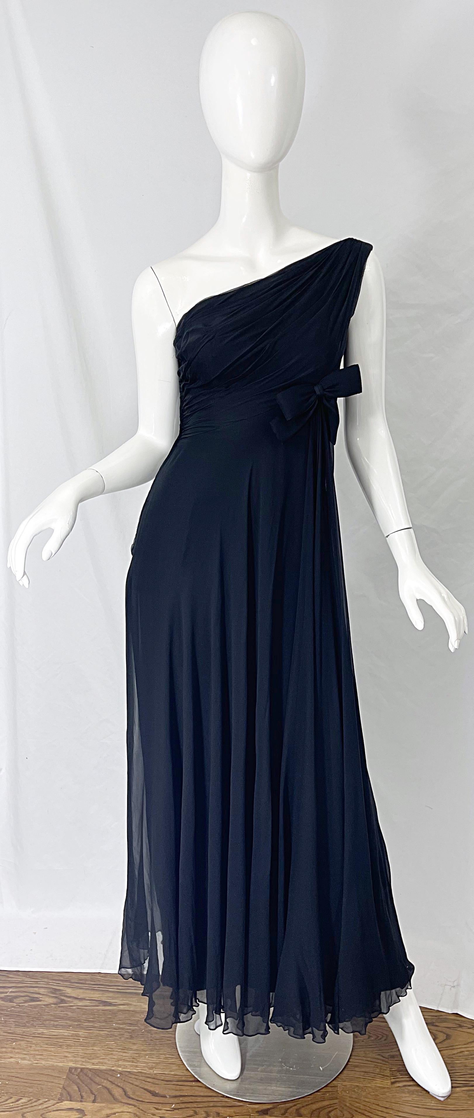 Beautiful 1960s MALCOLM STARR black silk chiffon Grecian inspired one shoulder evening dress / gown! Features a tailored bodice with an attached bow above the asymmetric waist line. Layers of long flowy chiffon on the skirt. Hidden metal zipper up