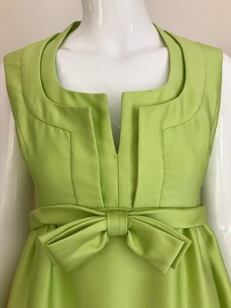 Beautiful 1960s Elinor Simmons for Malcolm Starr Green Sleeveless Silk Dress with beautiful neckline and bow.
Dress is lined and has pockets. 
Size: 2/4 Small
Bust: 34 inches/ Waist: 26 inches/ Hip: 40 inches/ Dress length: 53 inches

*** Dress has