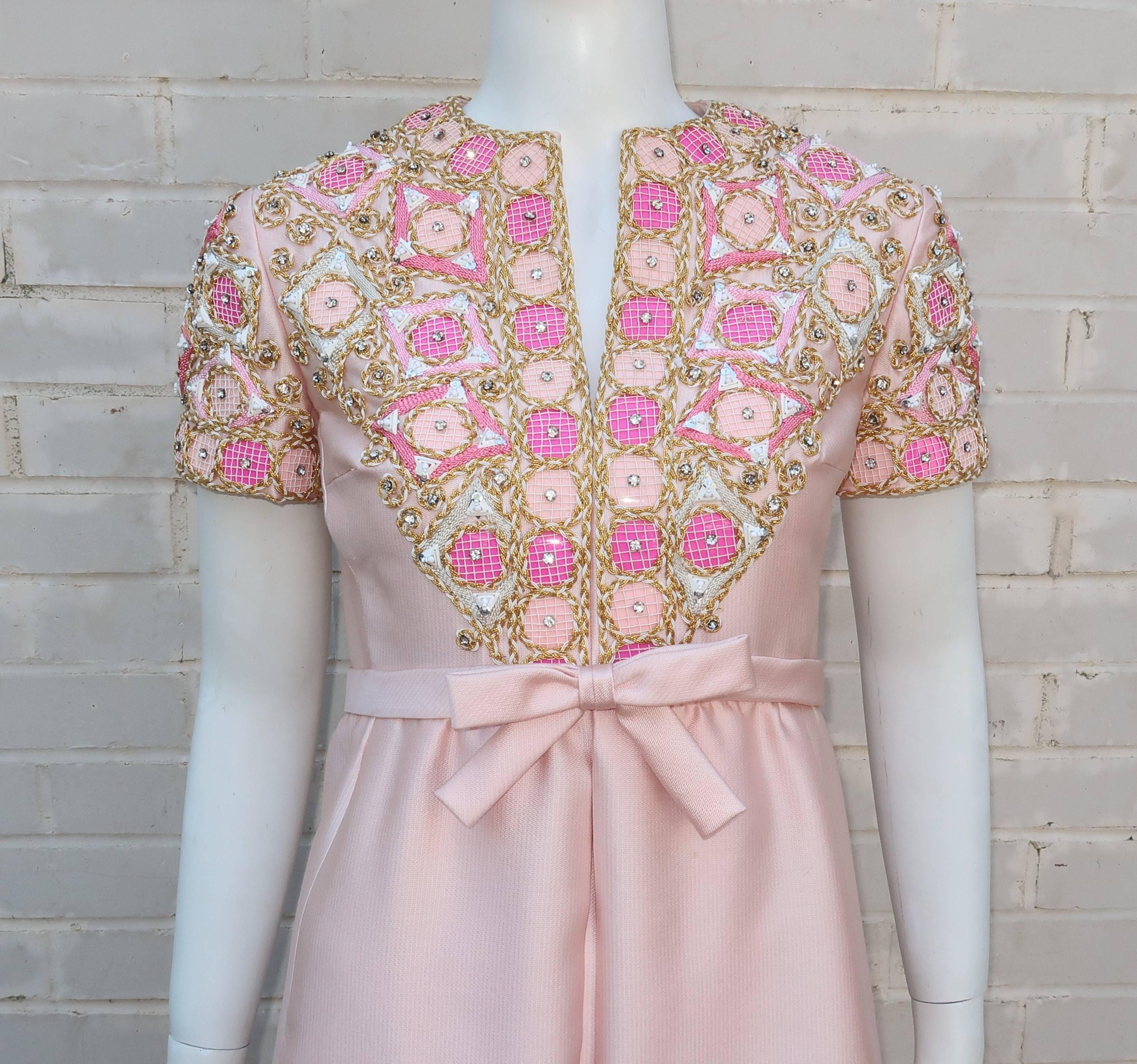 Pretty in pink!  And how!  This fabulous 1960’s Elinor Simmons design for Malcolm Starr incorporates both a girlish innocence with a mod aesthetic so wonderfully typical of the era.  The dress is designed with a modified empire waist in a heavy silk