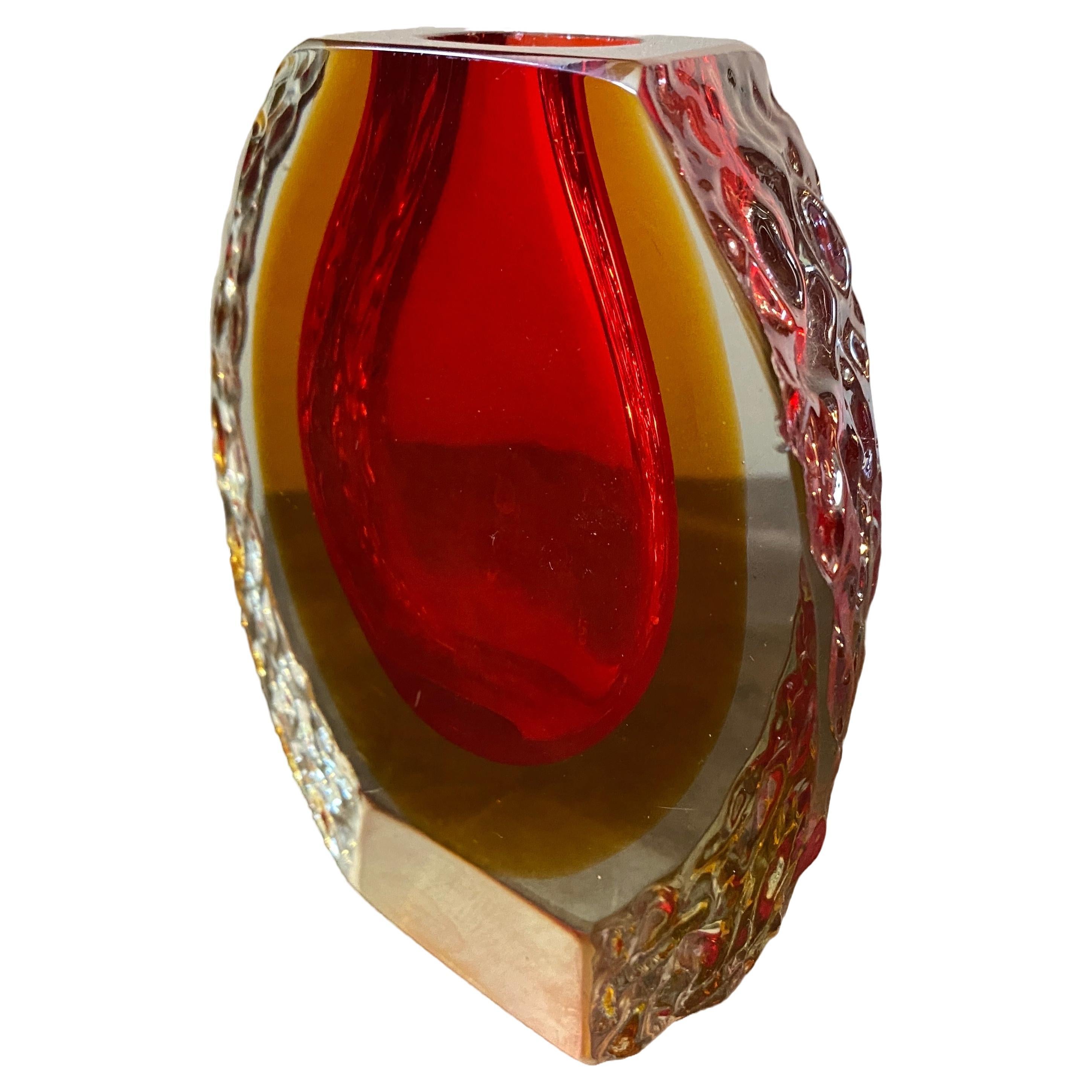 A red and yellow sommerso murano glass vase designed and manufactured in Venice in the Sixties by Mandruzzato in perfect condition. This Vase it's a beautiful fusion of art and function. It features the iconic Sommerso technique, embody the design