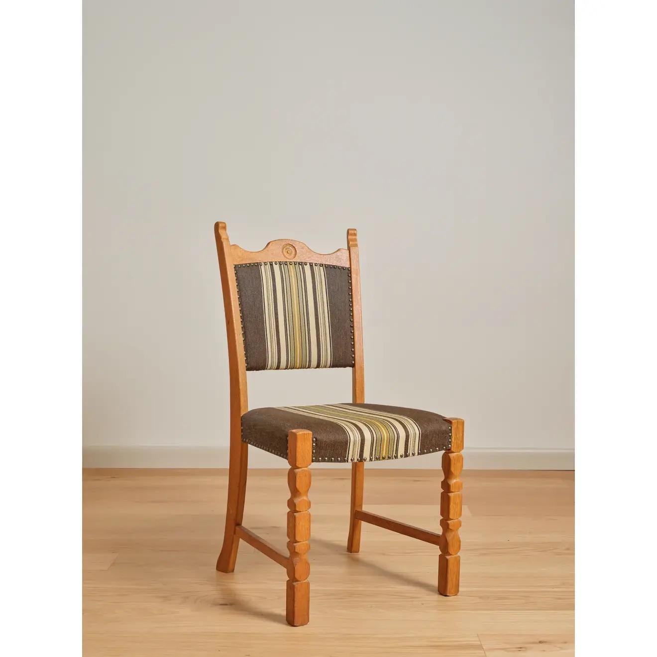 (6) upholstered dining chairs with carved roundels at the crest rails. In the manner of Henning (Henry) Kjaernulf; Scandinavian, c. 1960's-1970's.