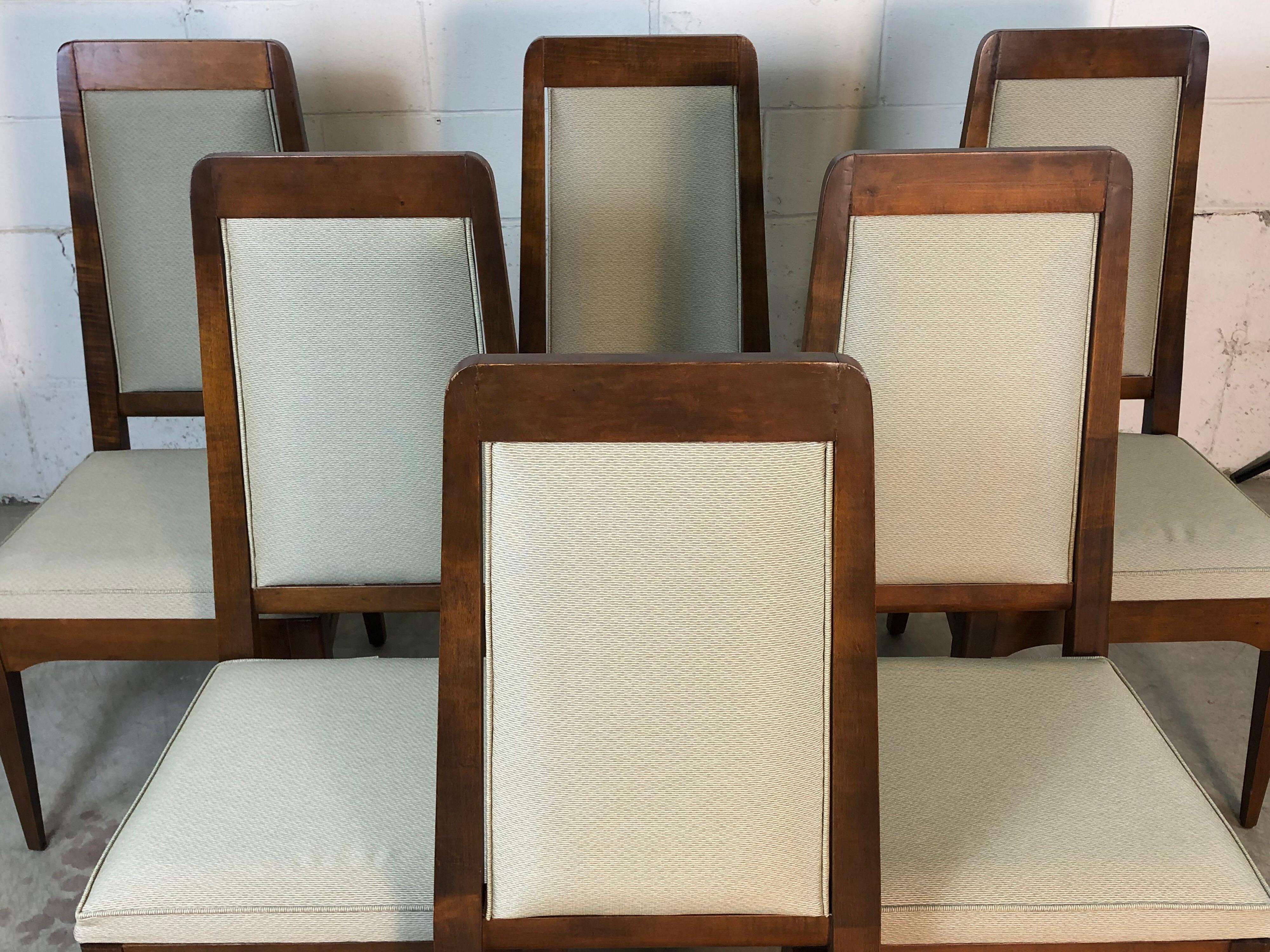 Mid-Century Modern 1960s set of 6 high back maple wood dining chairs with new reupholstered fabric and stainless steel accents. The patterned fabric is gray in color. The chairs have also been refinished and are sturdy. They are marked Made in