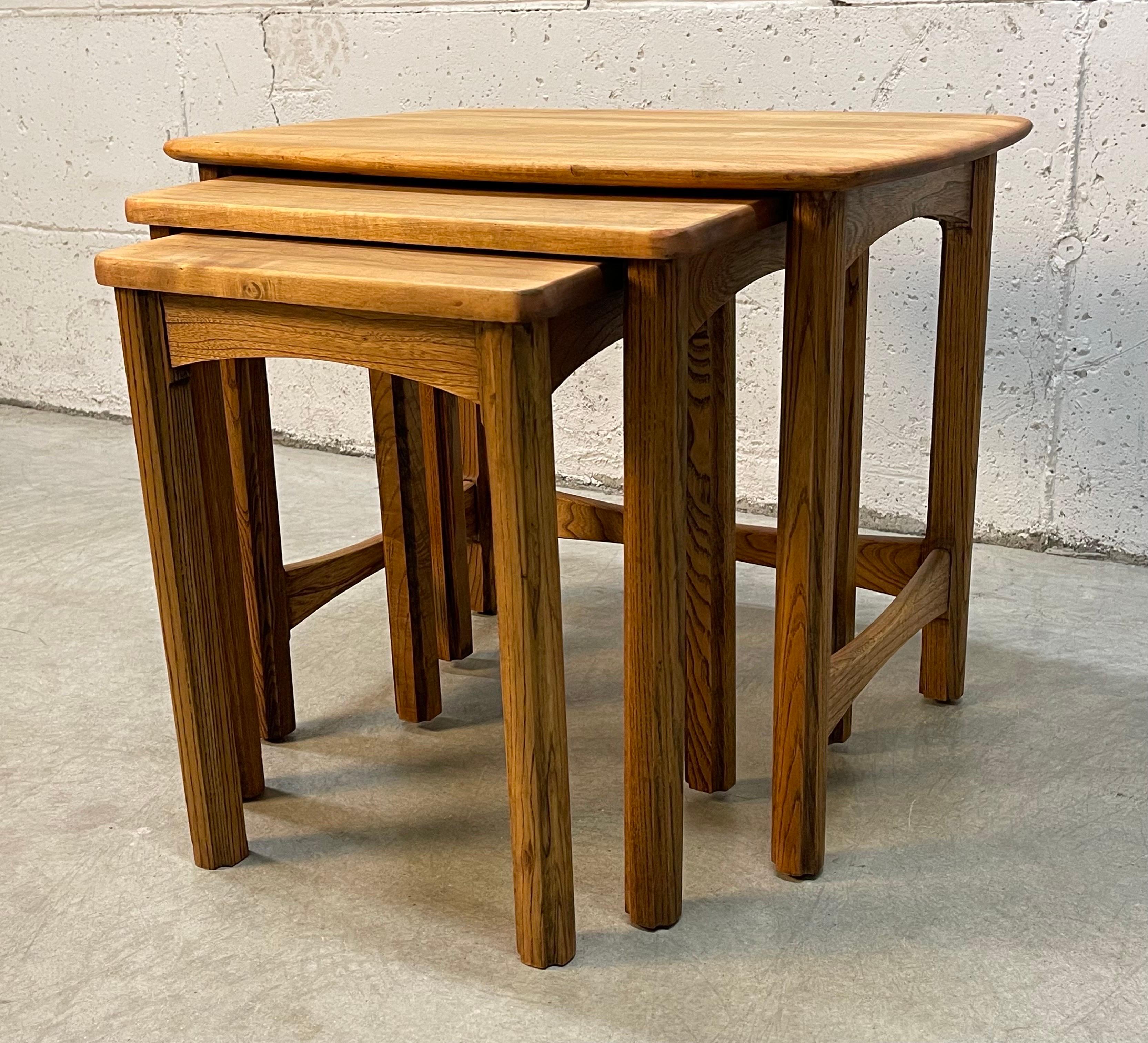 Vintage 1960s maple and oak wood nesting tables. The table tops have a rounded edge and all sit neatly within each other. The large table is 24” x 18” x 20”. Middle table is 18” x 14” x 19”. Small table is 13.5” x 12.5” x 18”. All tables are in